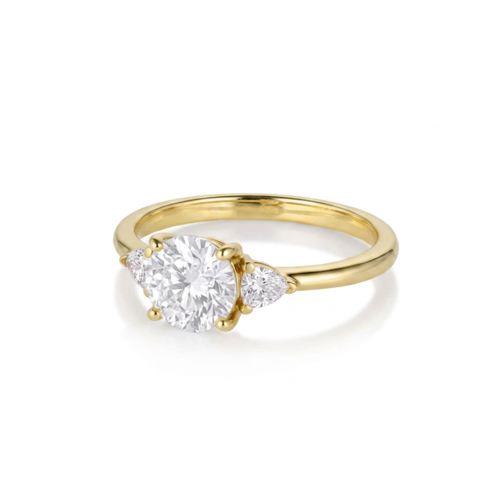 Round and trillion cut three stone diamond engagement ring in 14k yellow gold, three-quarter view on a white background