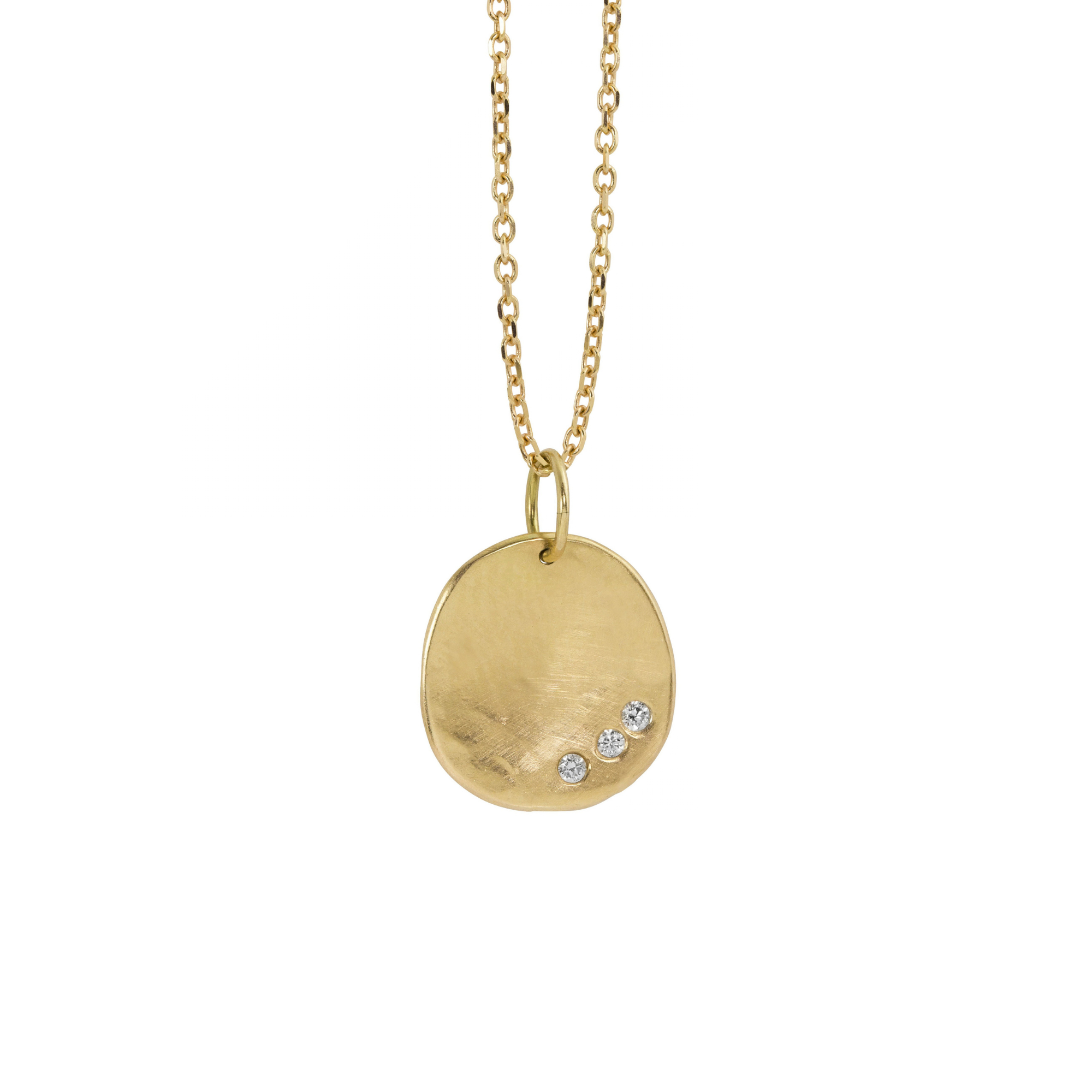 14k yellow gold round hammered pendant featuring three small white diamonds on a white background