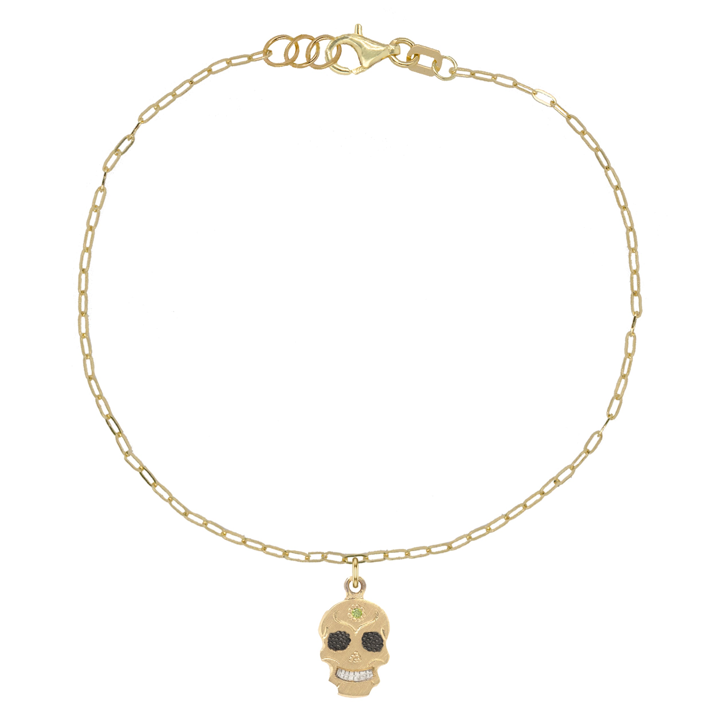 A 14k gold bracelet featuring a teeny tiny sugar skull charm on a thin link chain.