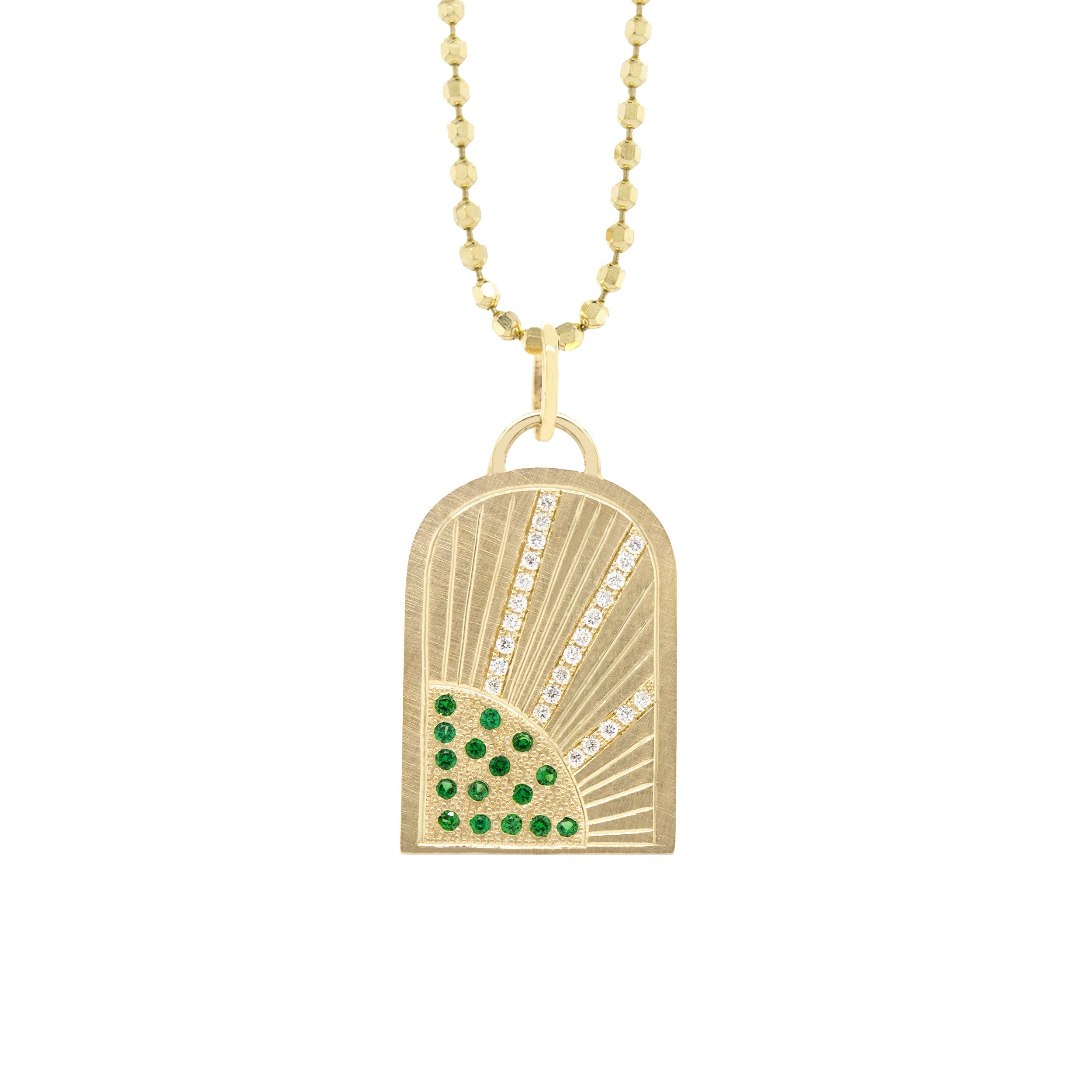 14k yellow gold arch pendant featuring green and white gemstones with etched sunrays on a white background