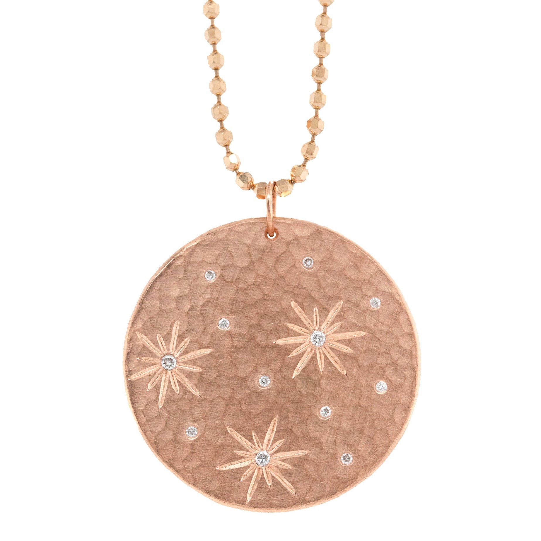 14k rose gold round hammered pendant featuring hand etched starbursts with white diamonds on a white background
