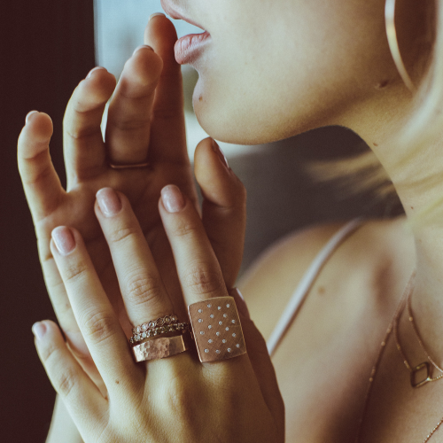 Model wearing stacking and statement rings by Julez Bryant