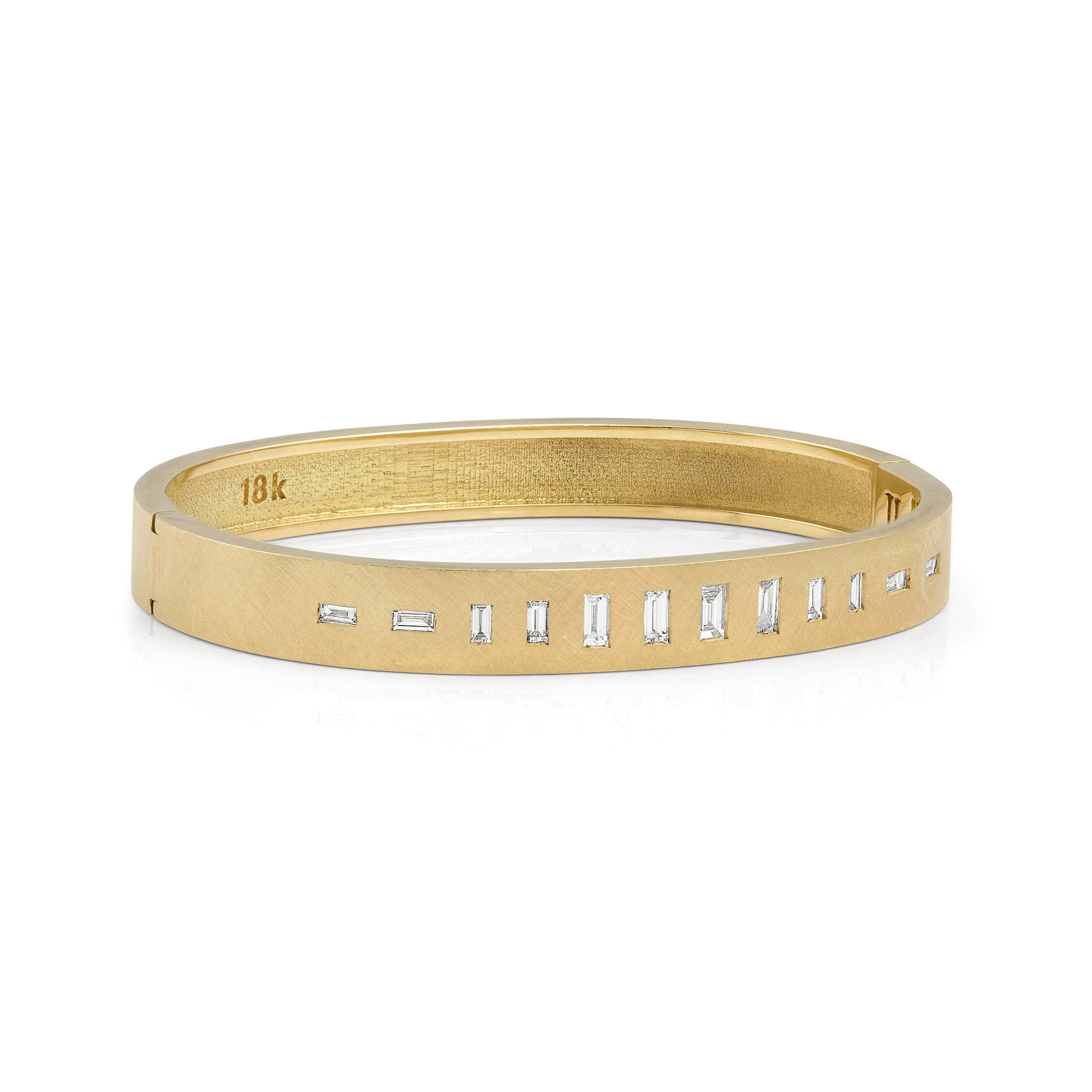 18k yellow gold hinged bangle bracelet with baguette cut white diamonds on white background