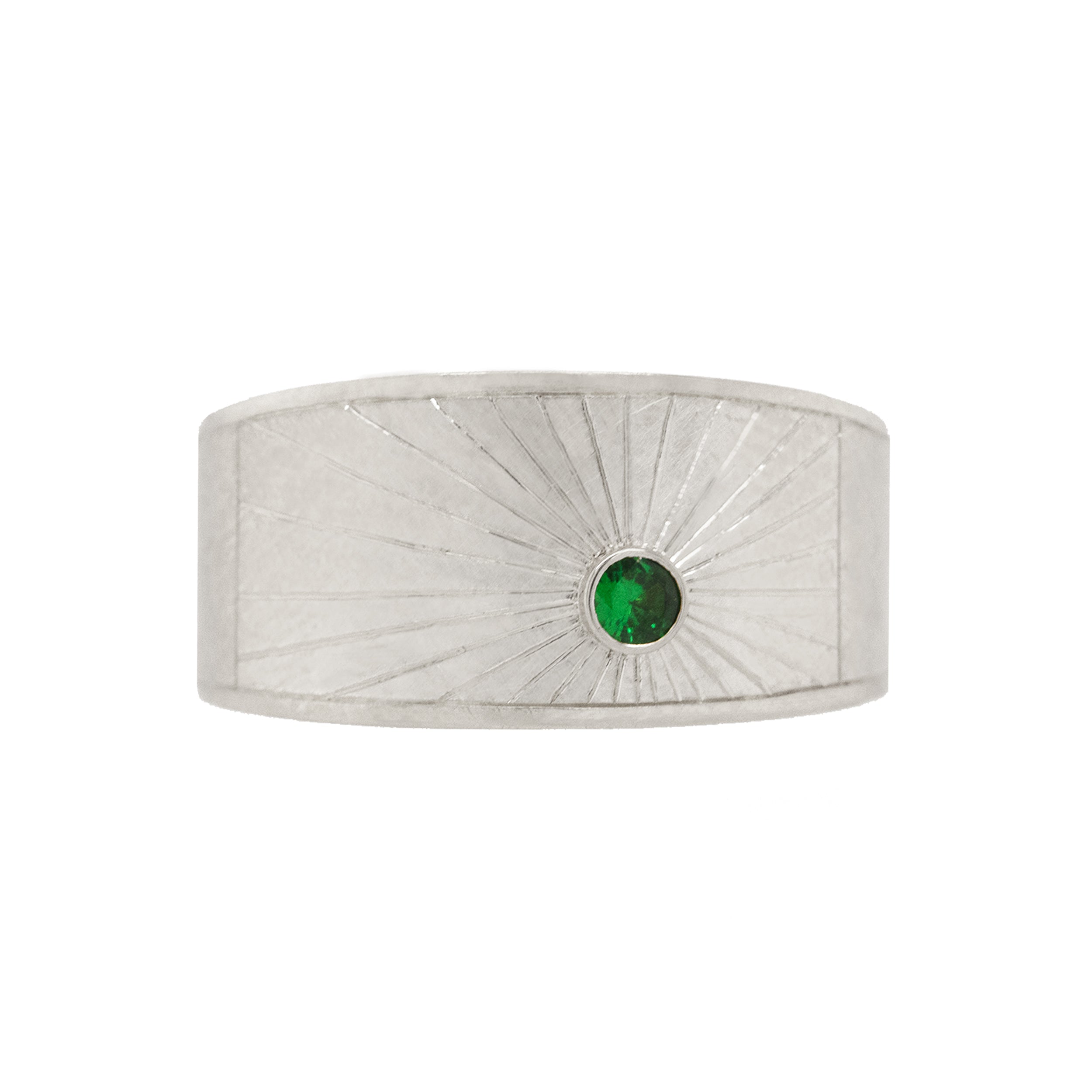 14k white gold wide band with hand etched sunburst and green tsavorite on white background