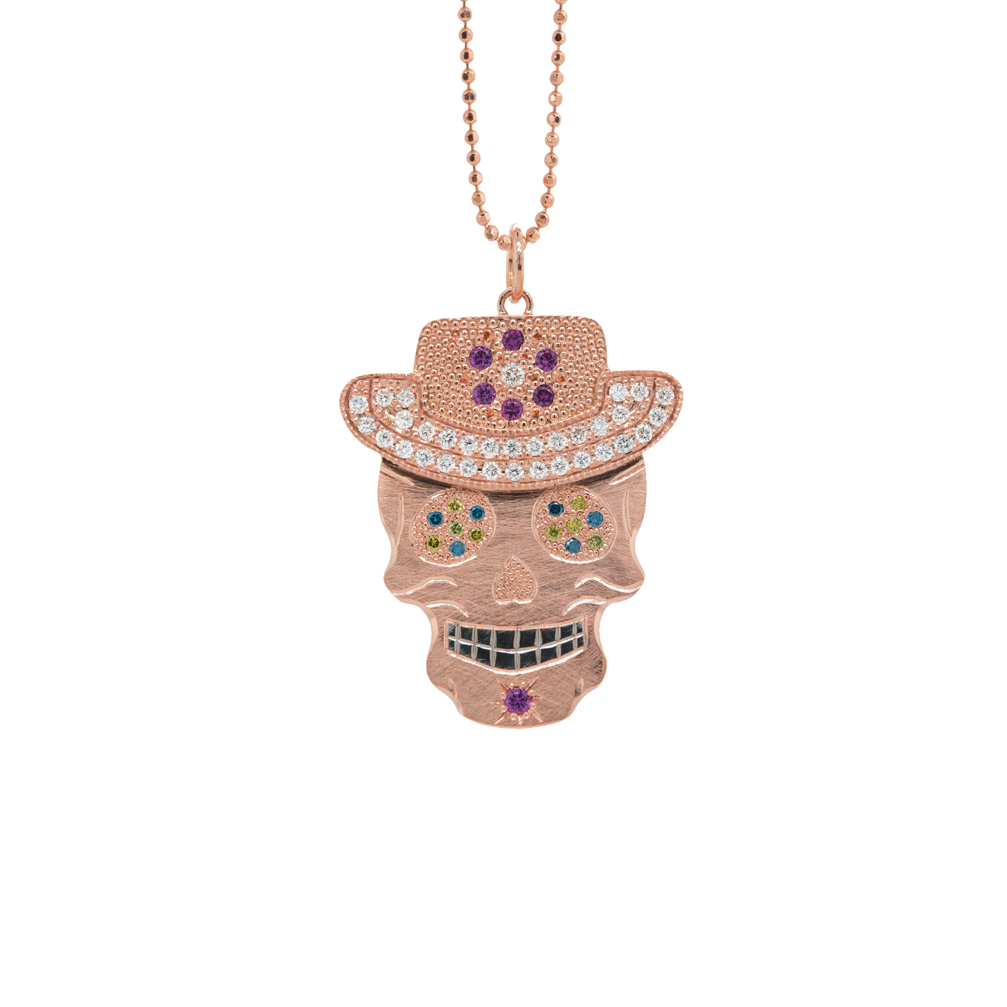 Vibrant colorful Julez Bryant original Ghostrider Collection Vaquero gemstone encrusted sugar skull wearing cowboy hat rose gold white rhodium darkened teeth. Extra large pendant in 14k solid rose gold mixed diamond sapphires and Tzavorite. Fine detail engraving highlights features. Hat of flower clustered jewels in mixed colors. Eyes with green Tzavorite and blue sapphire pave set gemstone eyes. Diamond encrusted brim Large pink sapphire and diamondFlower pave set detail on hat.  Shown on 2.0mm ball chain.