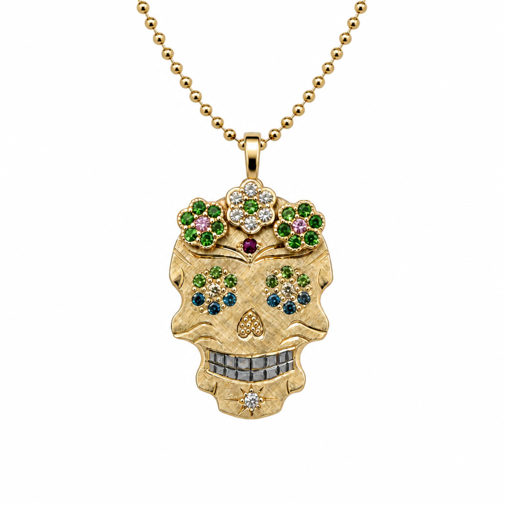 A gold sugar skull pendant necklace adorned with colorful gemstones, suspended from a gold ball chain against a plain white background.