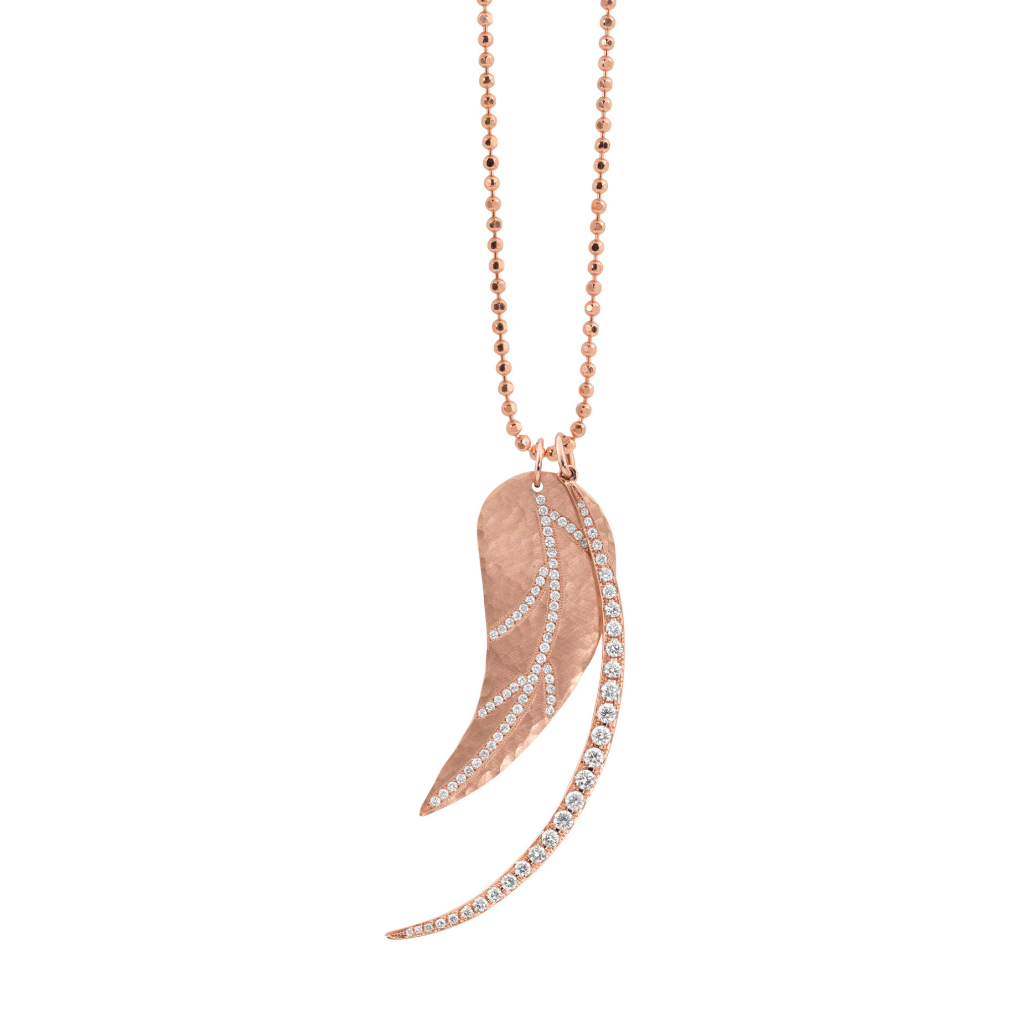 Rose gold necklace with a leaf-shaped cutout pendant paired with crescent moon with pave white diamonds on a white background