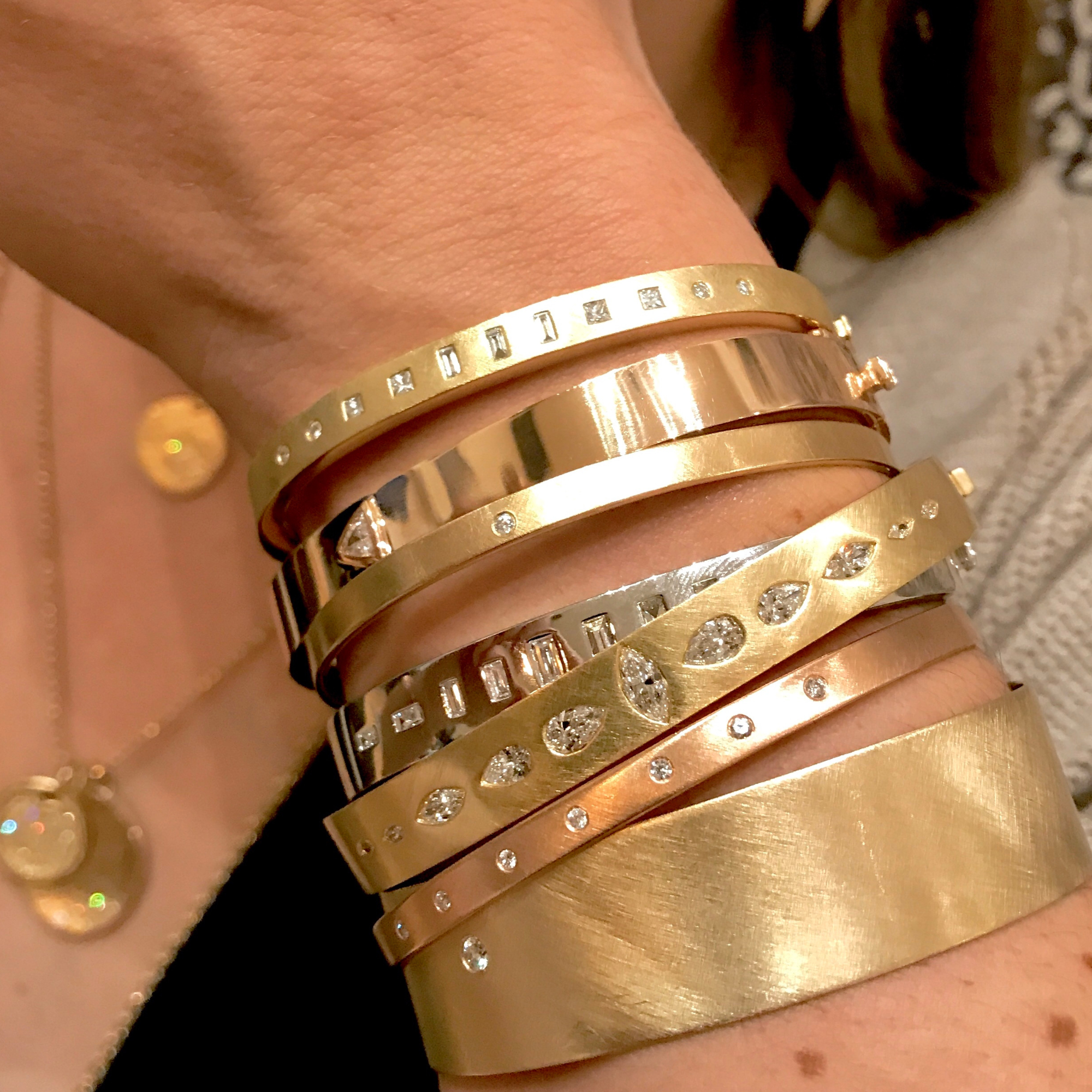 14k gold bangle stack on model in lifestyle shot
