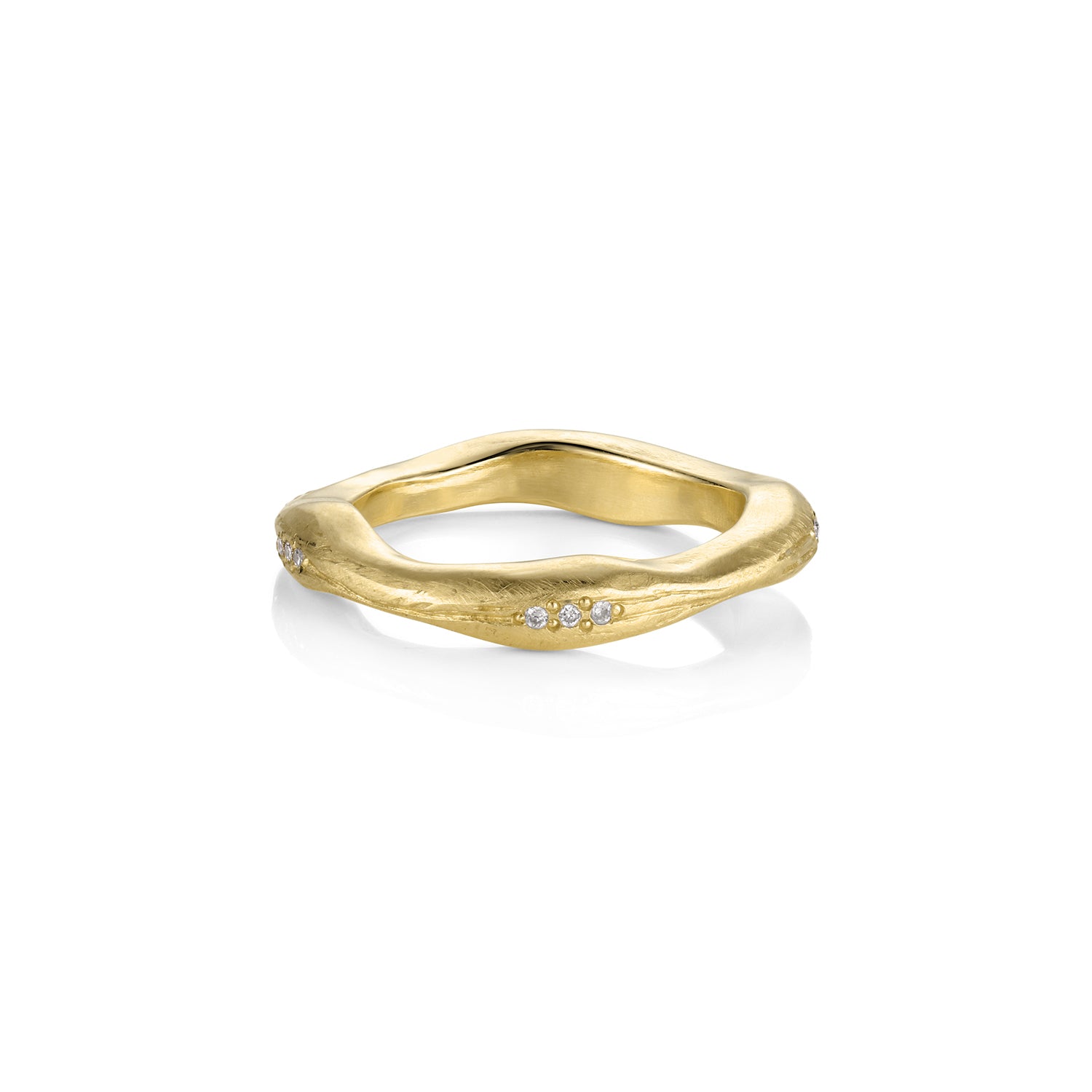 14k Gold stacking ring organic thick and thin with small bead set  diamonds, satin finish. Shown laying flat with a white background.