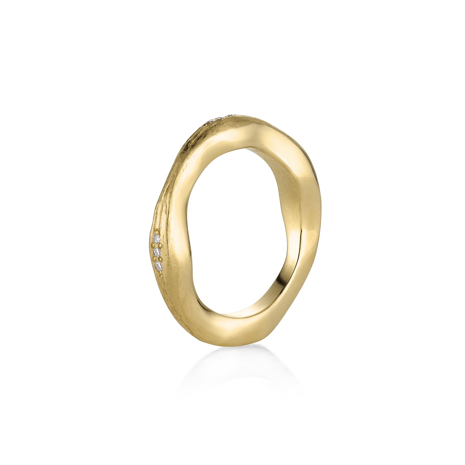 14k Gold stacking ring organic thick and thin with small bead set  diamonds, satin finish. Shown on side with a white background.