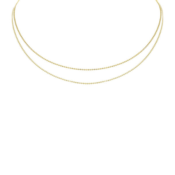 14k yellow gold dainty 1.0mm diamond cut ball chain double strand necklace in 14k yellow gold on white background.