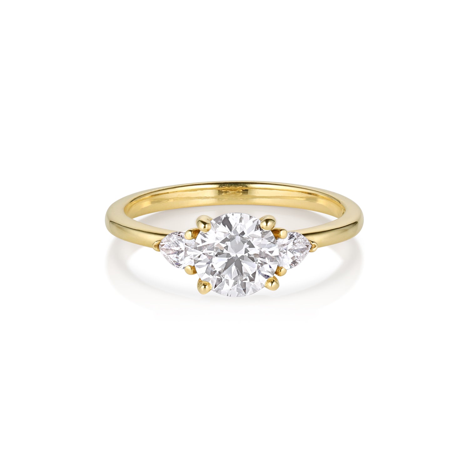 A 14k gold ring featuring a round white diamond in a prong setting flanked by two trillion accent diamonds, with a narrow band.