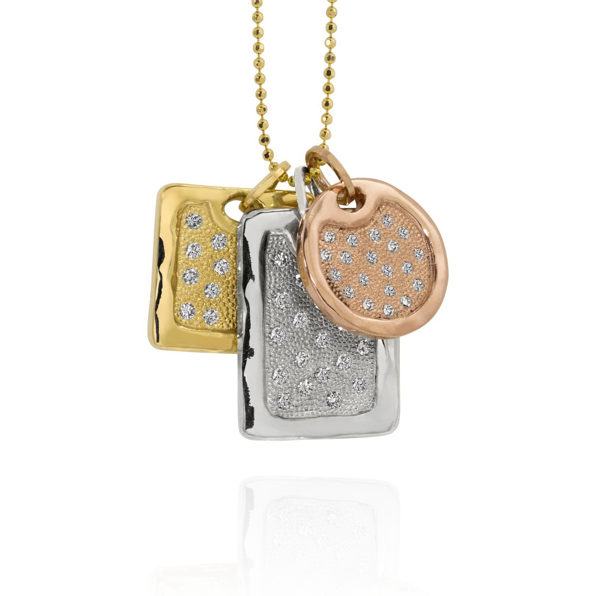 14k yellow gold square dogtag with milgrain texture and scattered white diamonds paired with white gold rectangle dogtag pendant with milgrain texture and scattered white diamonds paired with rose gold round pendant with milgrain texture and scattered white diamonds on diamond cut ball chain on a white background