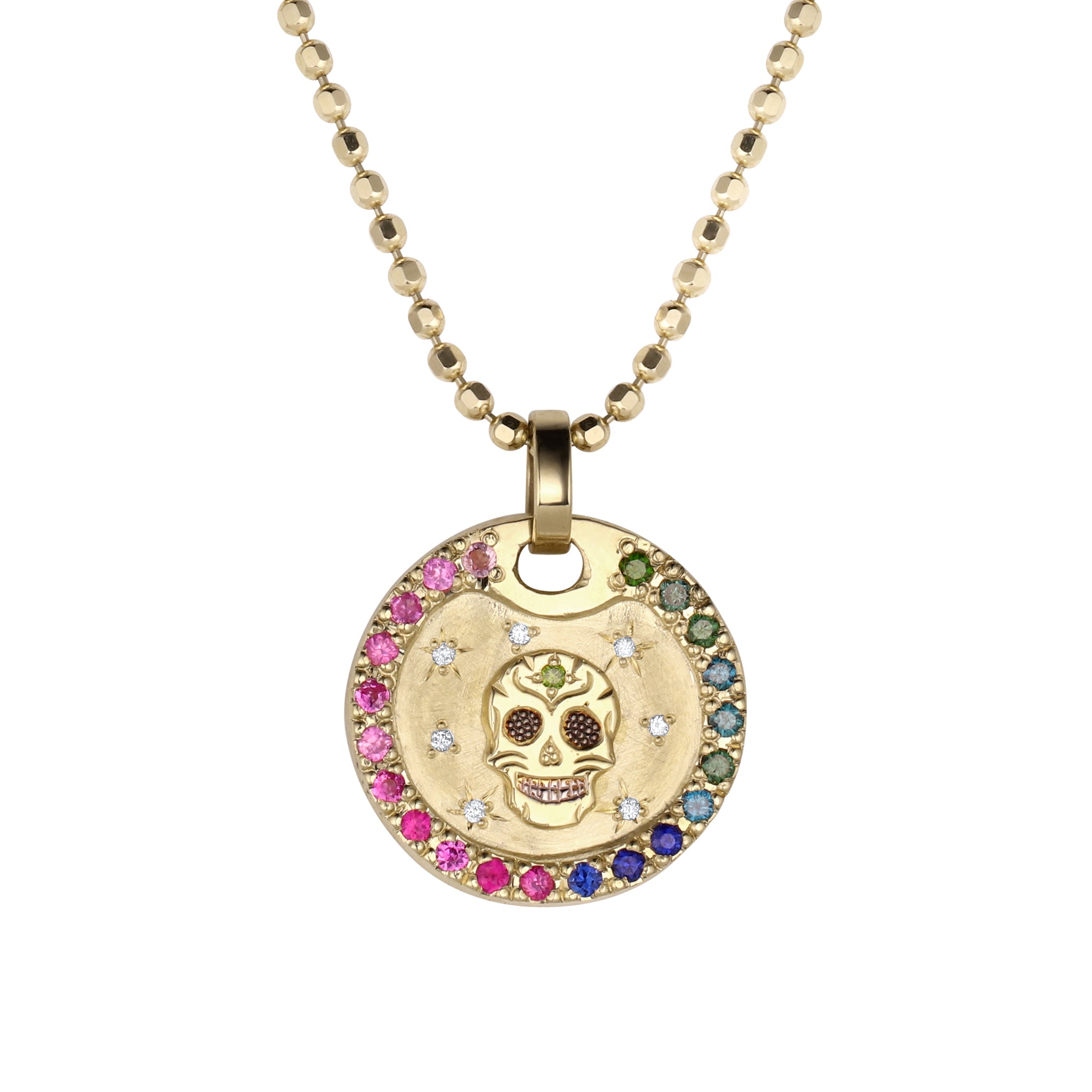 14k gold necklace with a colorful pendant featuring a raised skull design and halo rainbow gradient sapphire border. White diamond starburst accents. Shown on thick diamond cut ball chain on a white background.