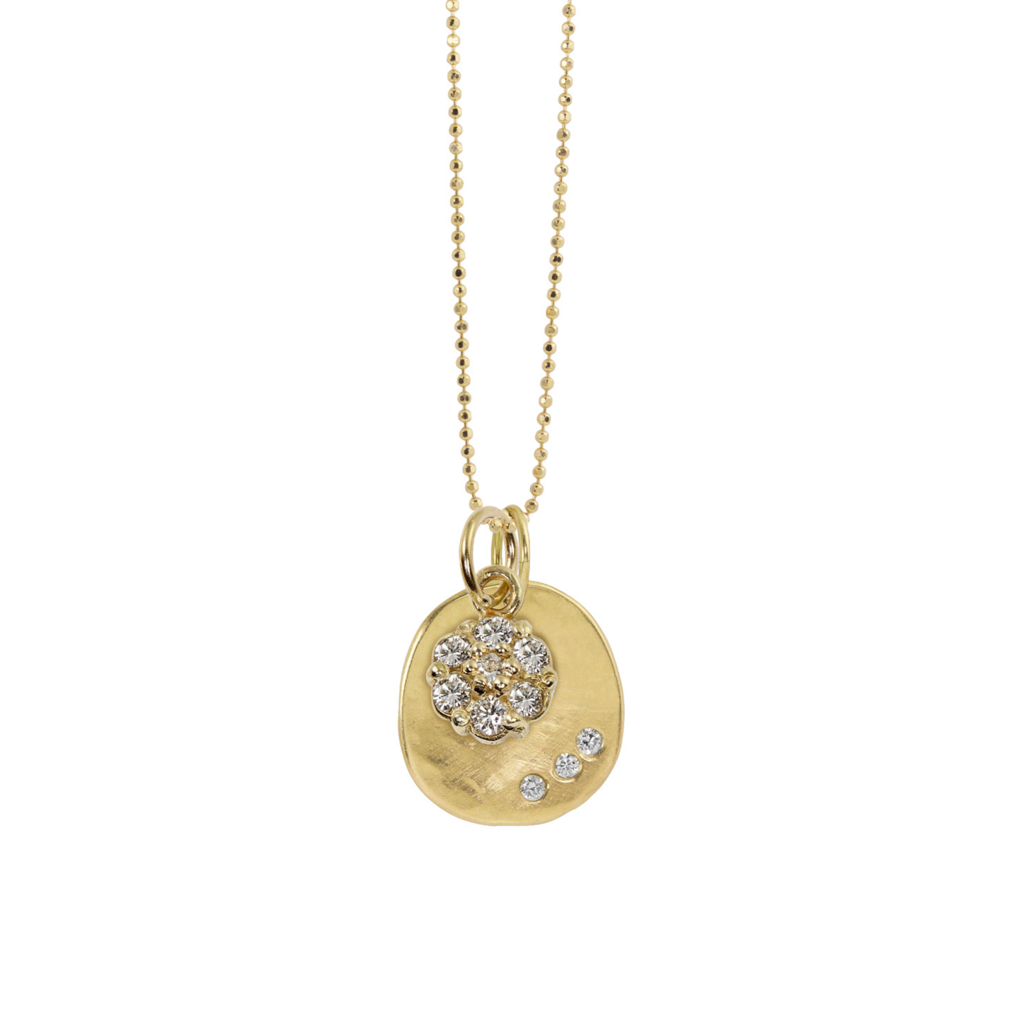14k yellow gold pendants featuring a diamond cluster design and round pendant with trio of white diamonds on diamond cut ball chain on a white background