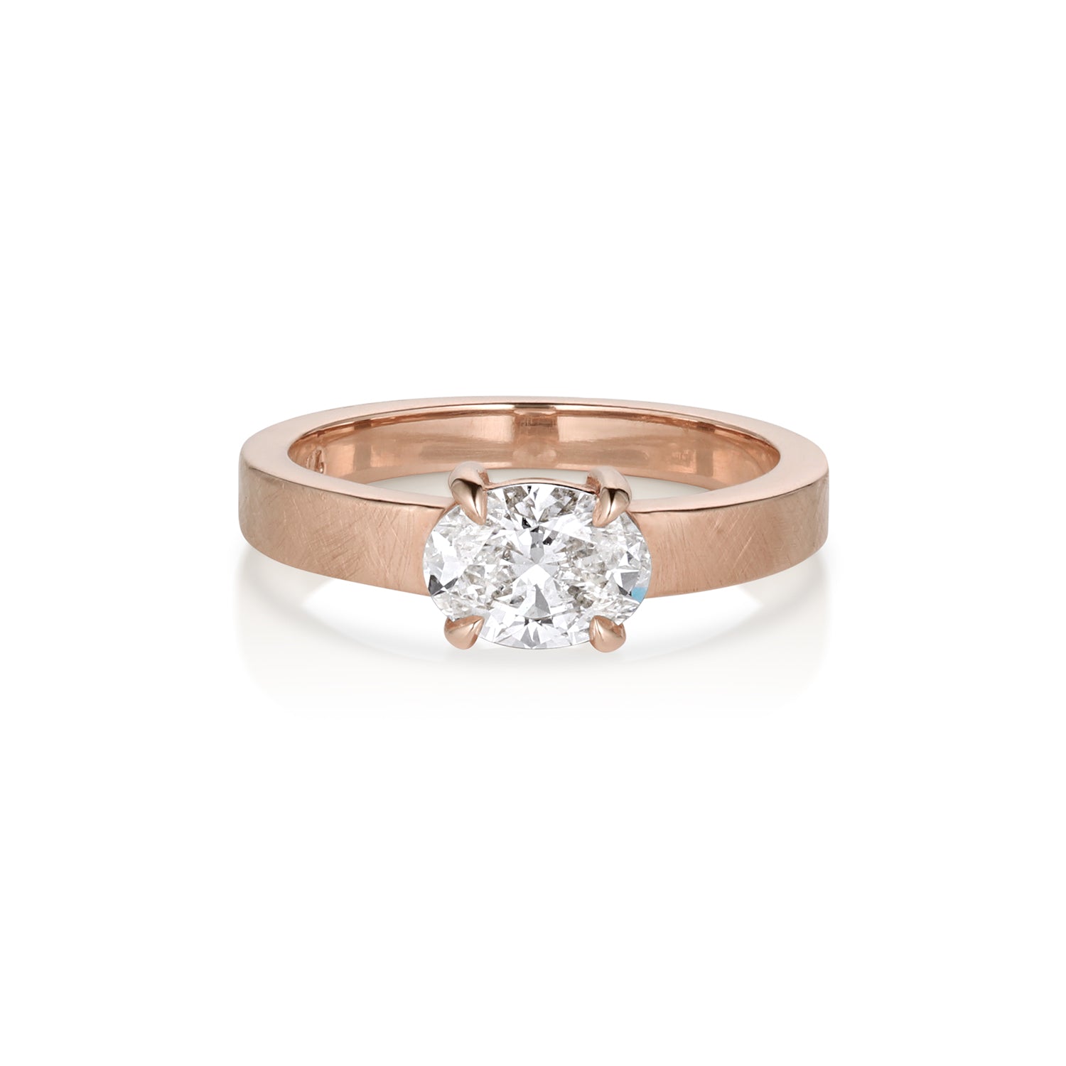 14 k rose gold ring with oval prong set diamond this satin finish on a white background band