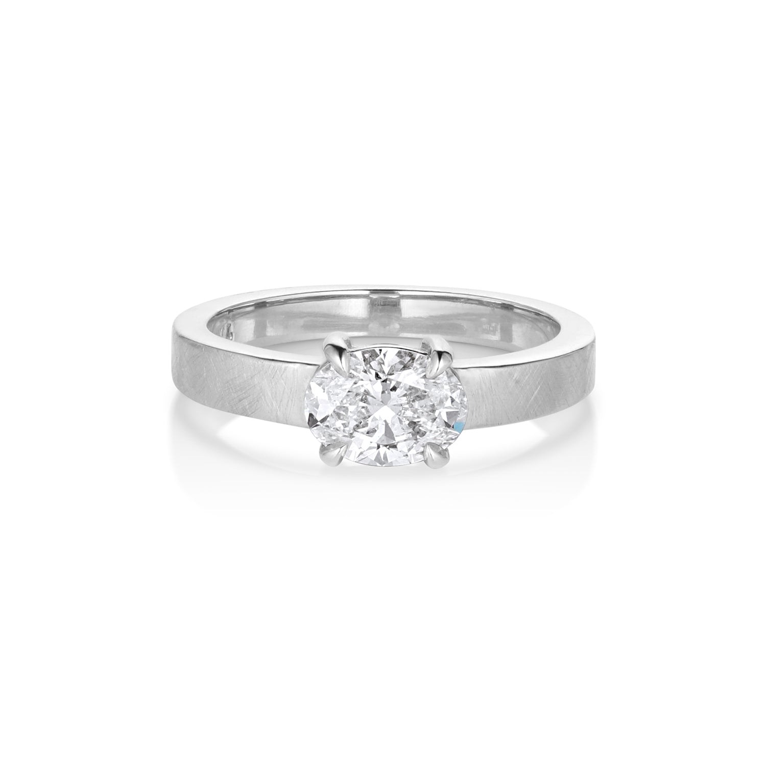 Square thick shank ring with satin finish and single stone solitaire white oval prong set diamond on white background