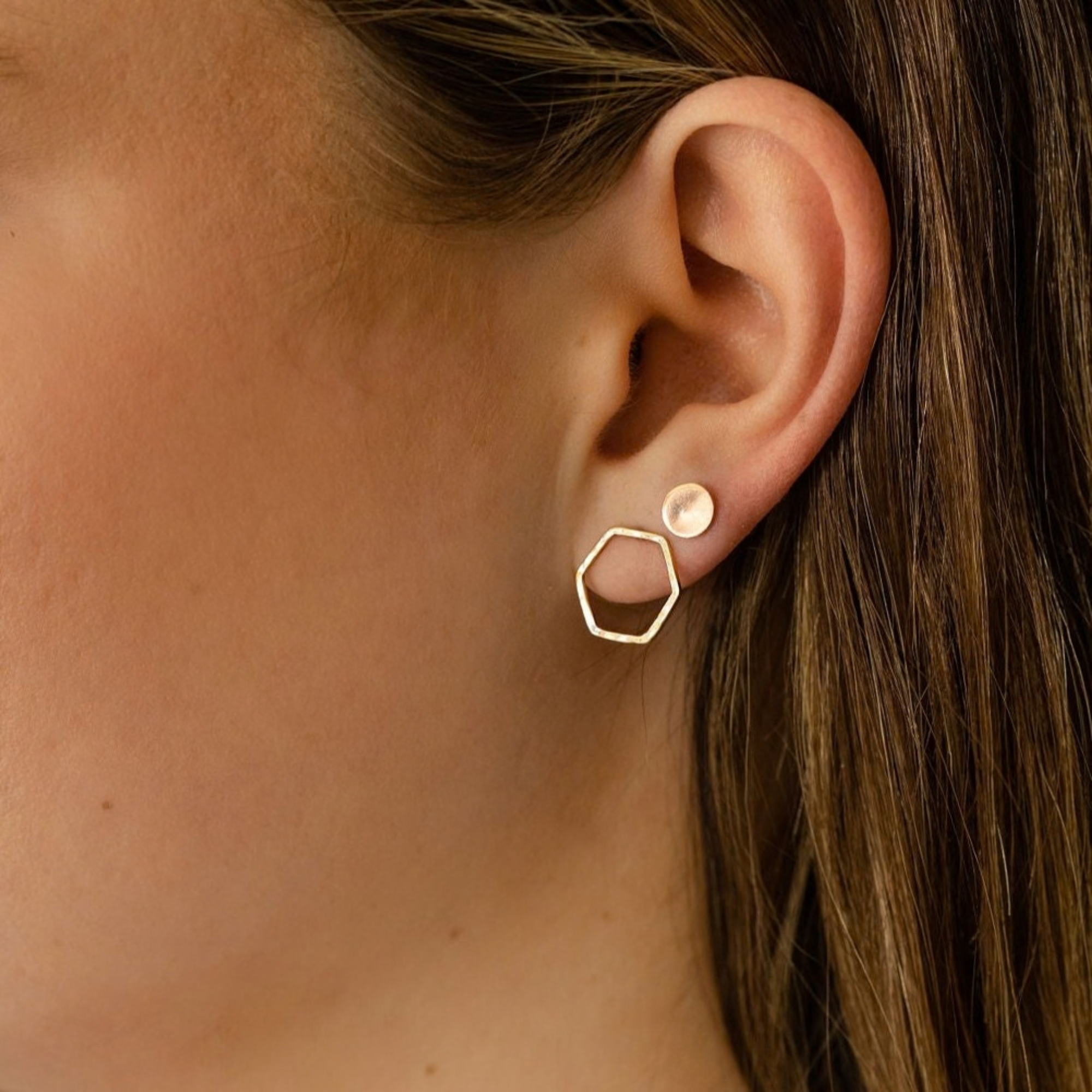 14k white gold open hexagon stud earrings on model in lifestyle shot