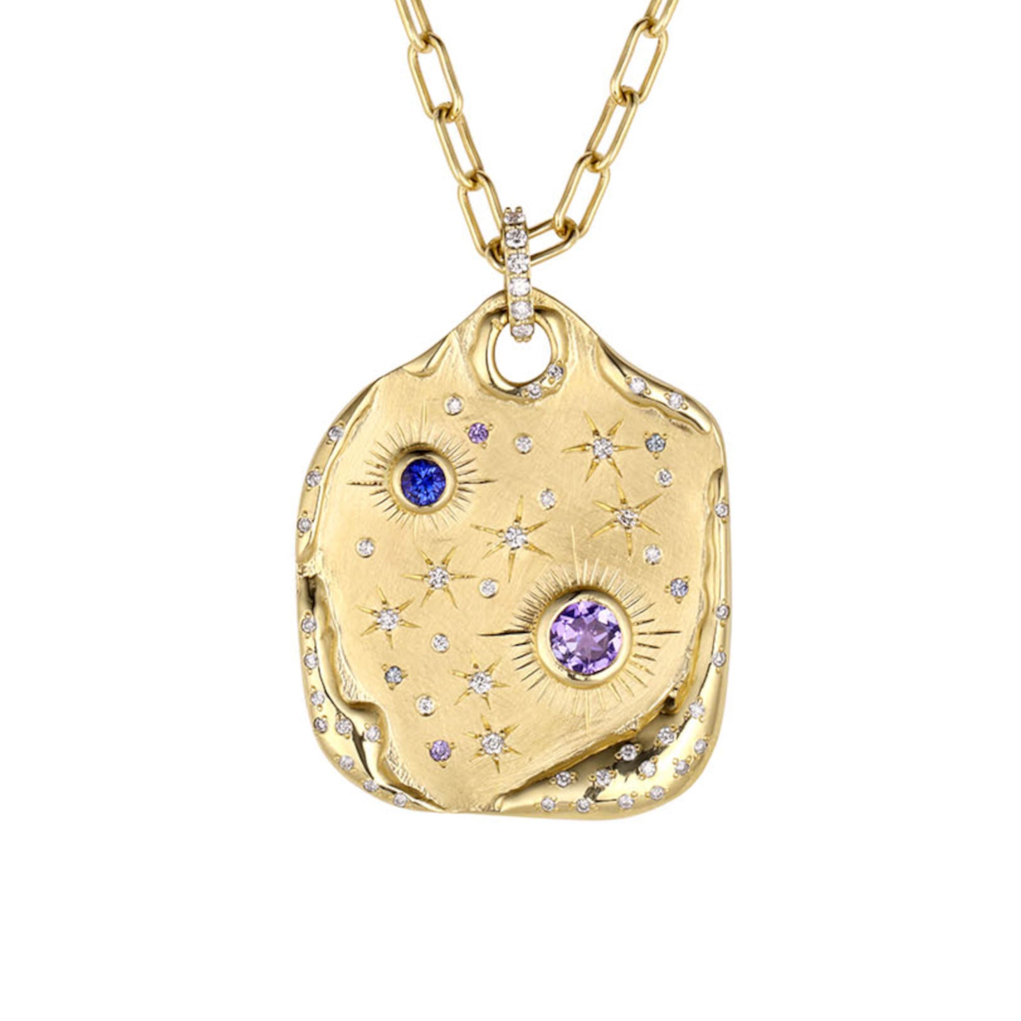 Extra large 14k gold pendant necklace with white Diamonds, Tanzanite and blue Sapphires. Cosmic motif with bezel and flush set gemstone stars with hand engraved details. Pave diamond bale hanging on a round link chain, on a white background.