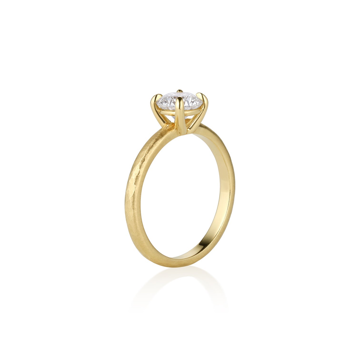 Single stone solitaire 14k gold ring with a white diamond satin finish metal shown on a white background., side view.