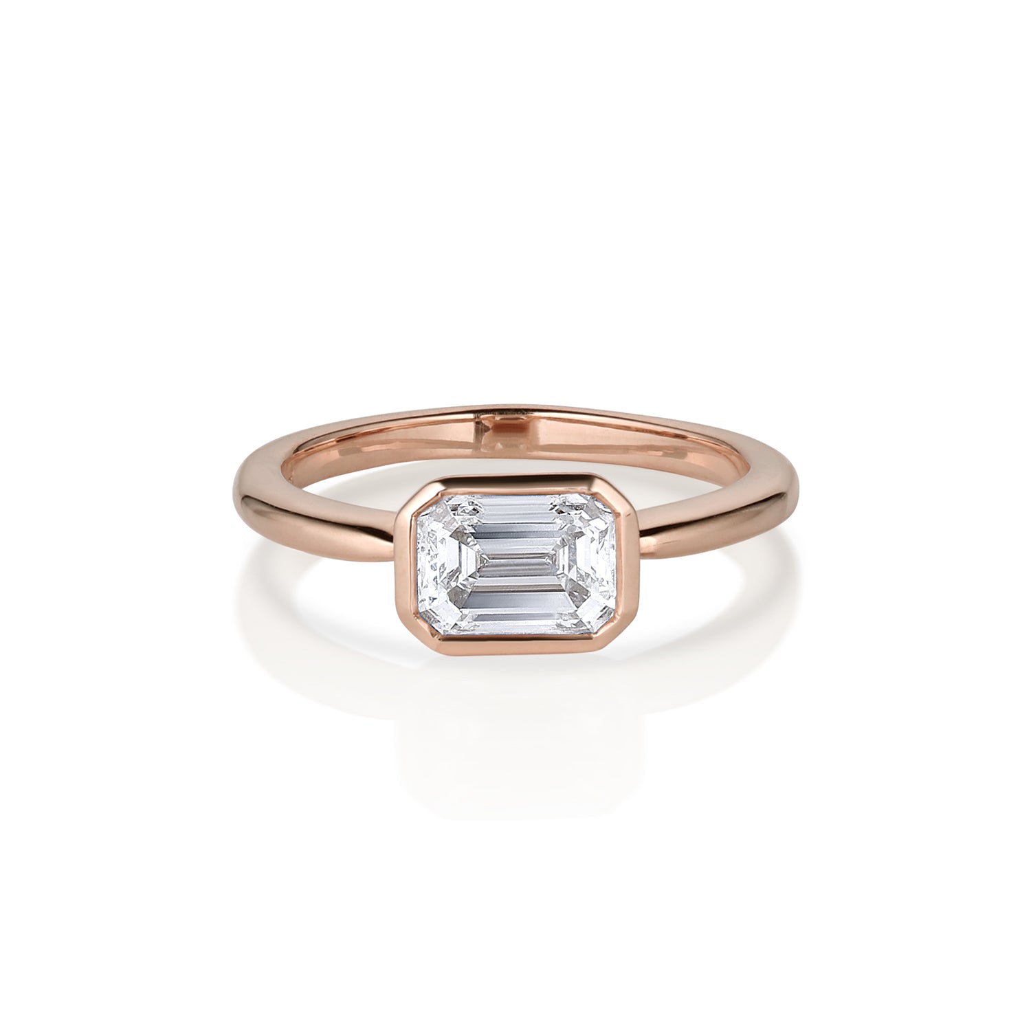 Asscher cut rose gold solitaire ring with a bezel setting shown on a white background