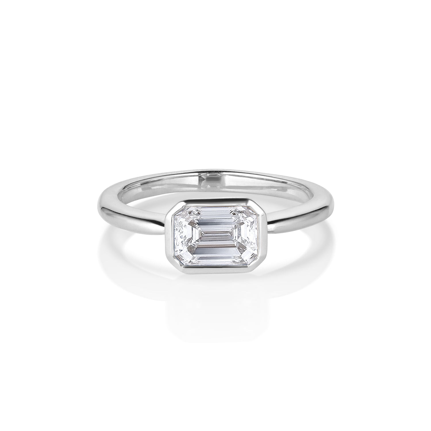 Asscher cut white gold solitaire ring with a bezel setting shown on a white background