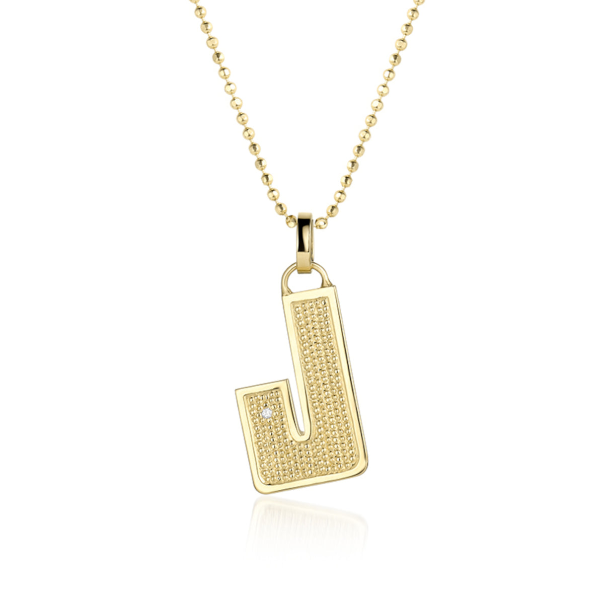 14k yellow Gold pendant shaped like the letter "J"  features single white diamond accent with  textured surface. Pendant on diamond ball chain, shown on white background.