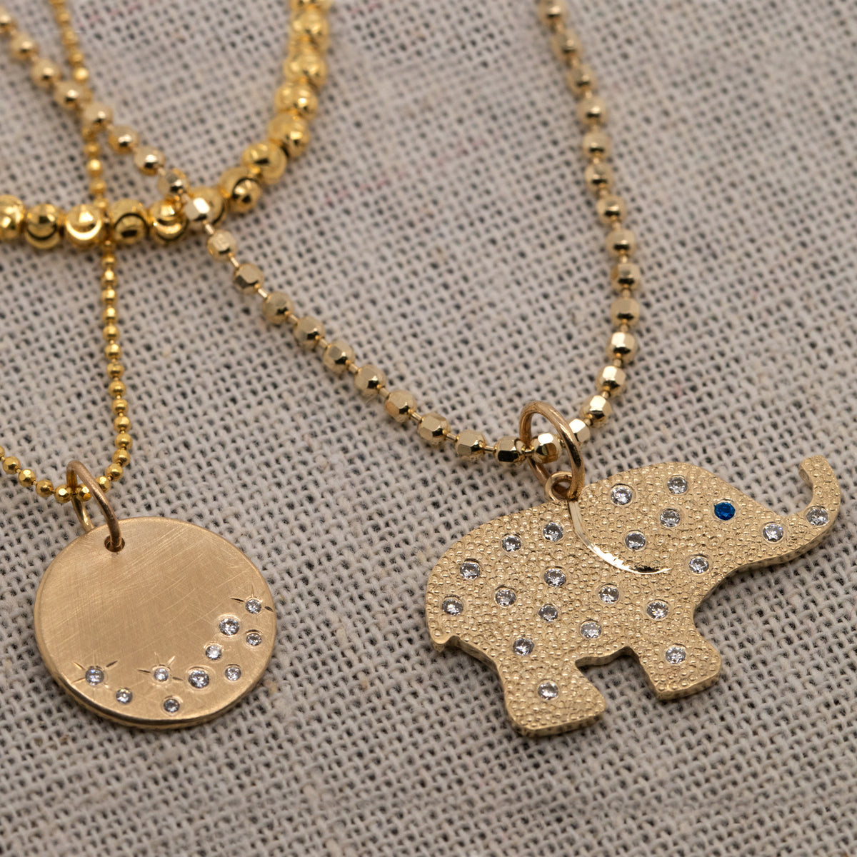 14k gold elephant pendant in lifestyle shot