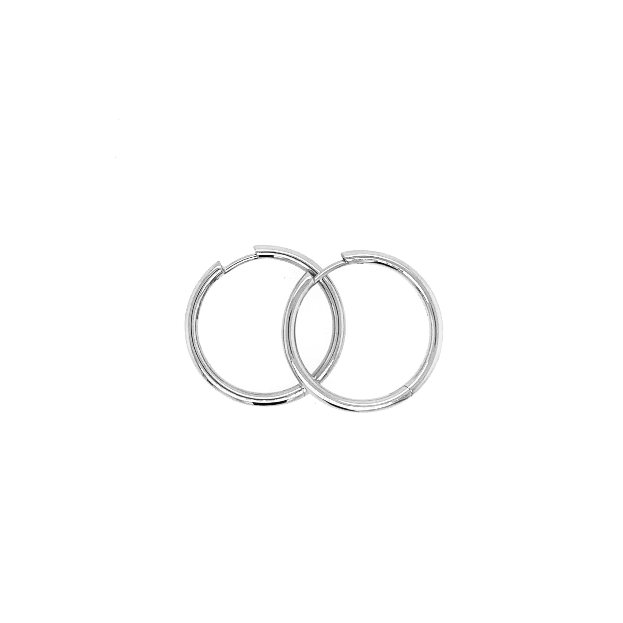 14k white gold hinged hoop earrings on white background