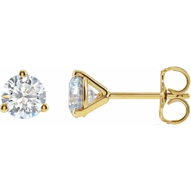 A pair of 14k yellow gold stud earrings with lab-grown diamond centers, set in classic 3-prong settings.