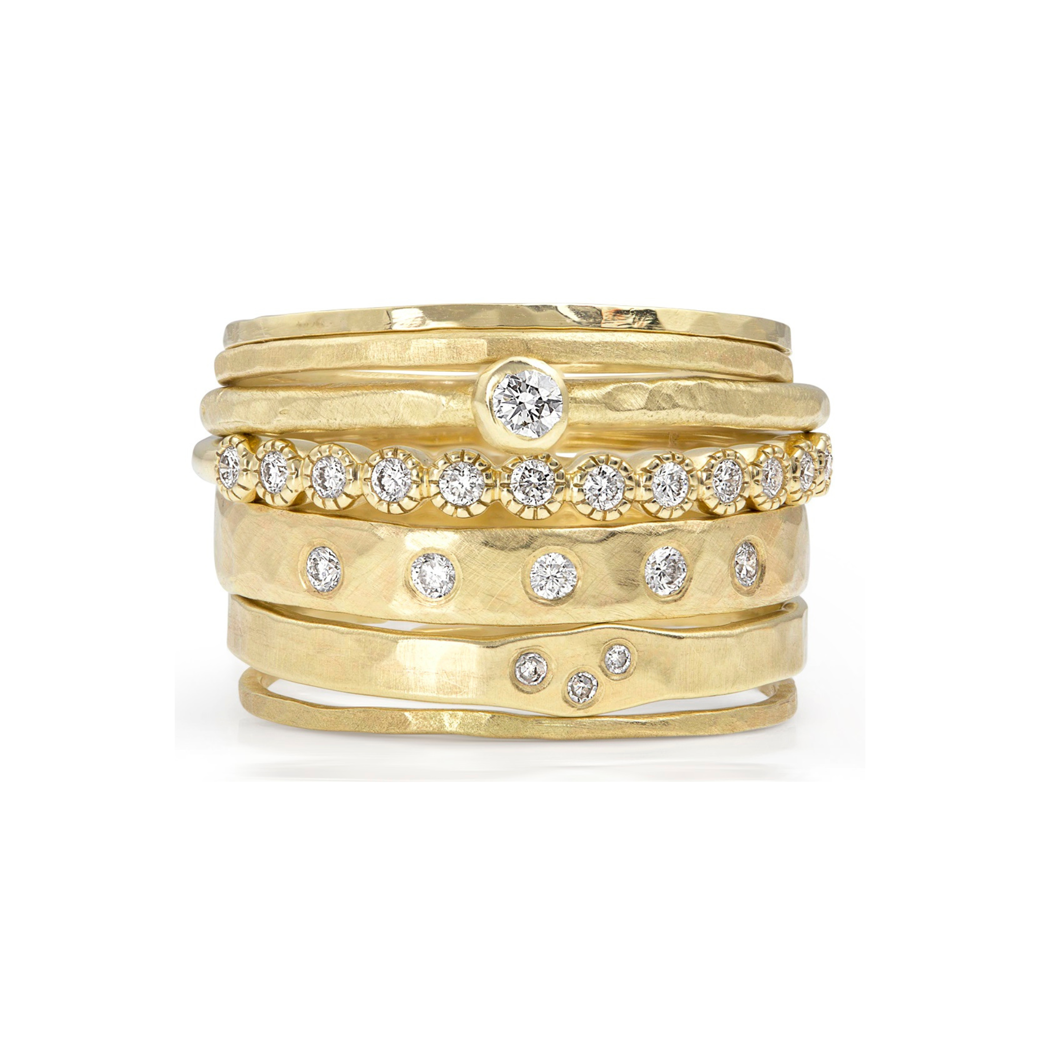 14k yellow gold stackable hammered ring with small white diamonds stacked with other julez bryant stacking rings on a white background