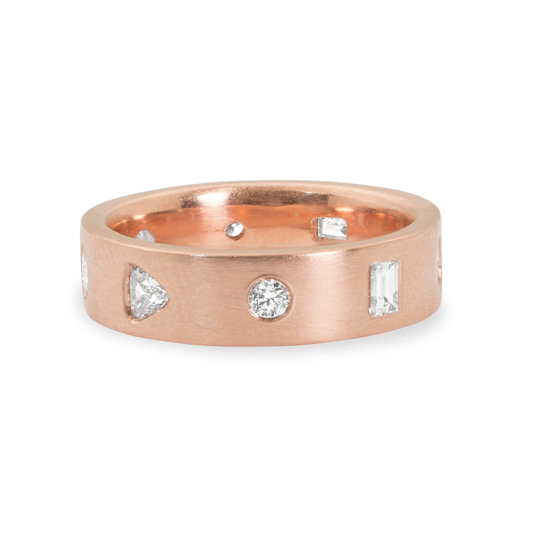 Rose gold ring with unique shaped embedded diamonds on a white background