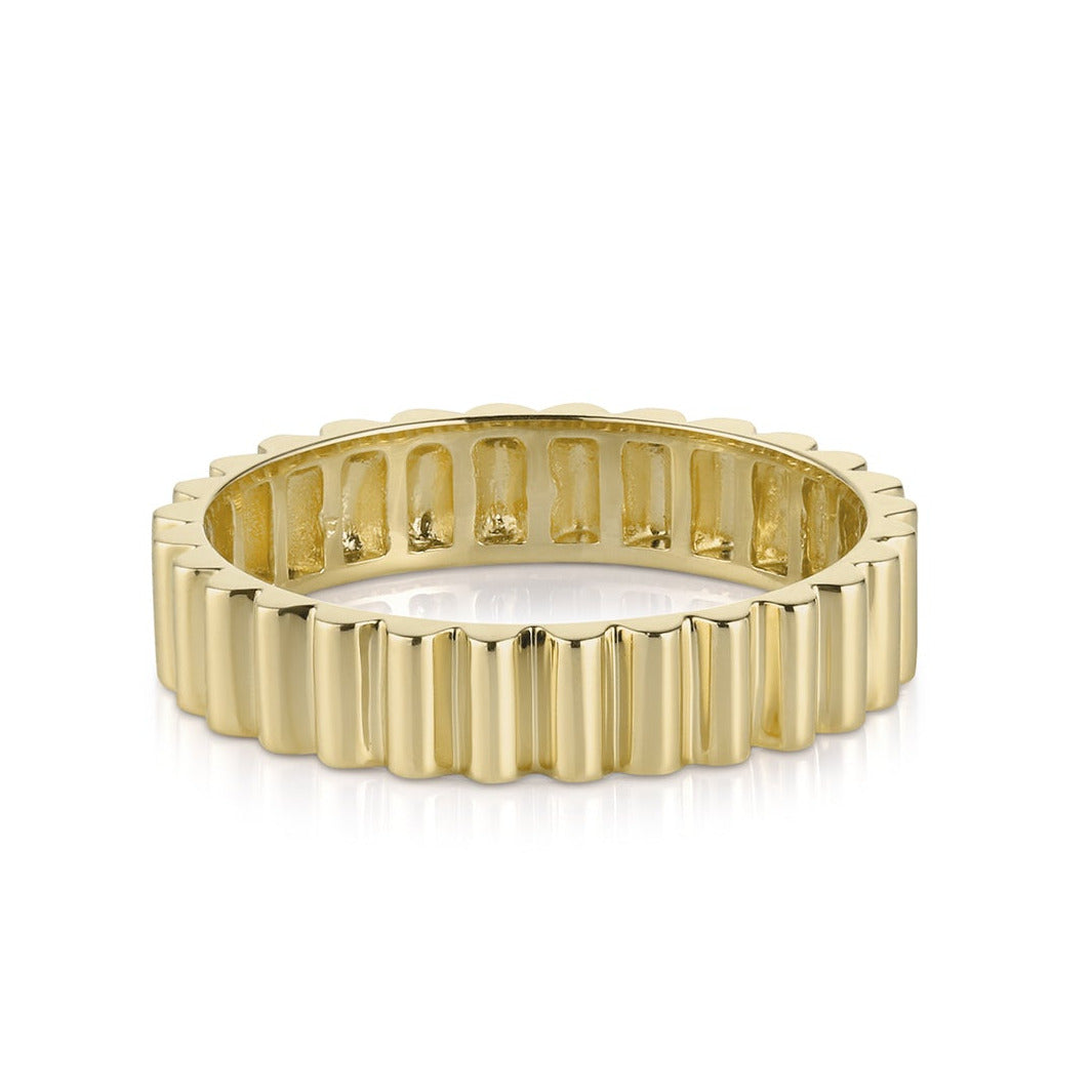 A solid 14k yellow gold ring with a geometric, sculptural pattern designed for stacking or as a statement piece.