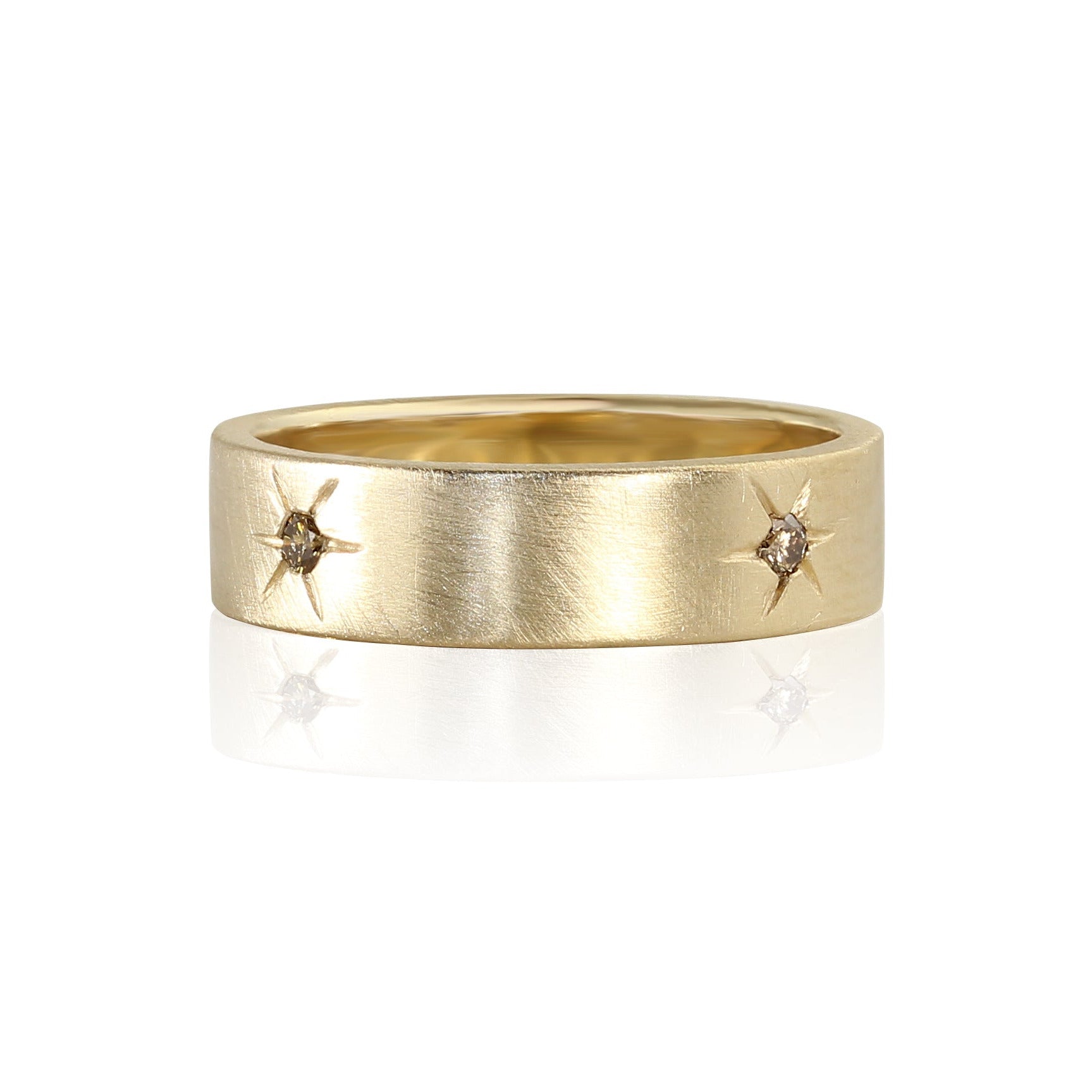 14k yellow gold ring with embedded cognac diamonds and engraved starburst details encircling band satin brushed finish shown laying flat on a white background