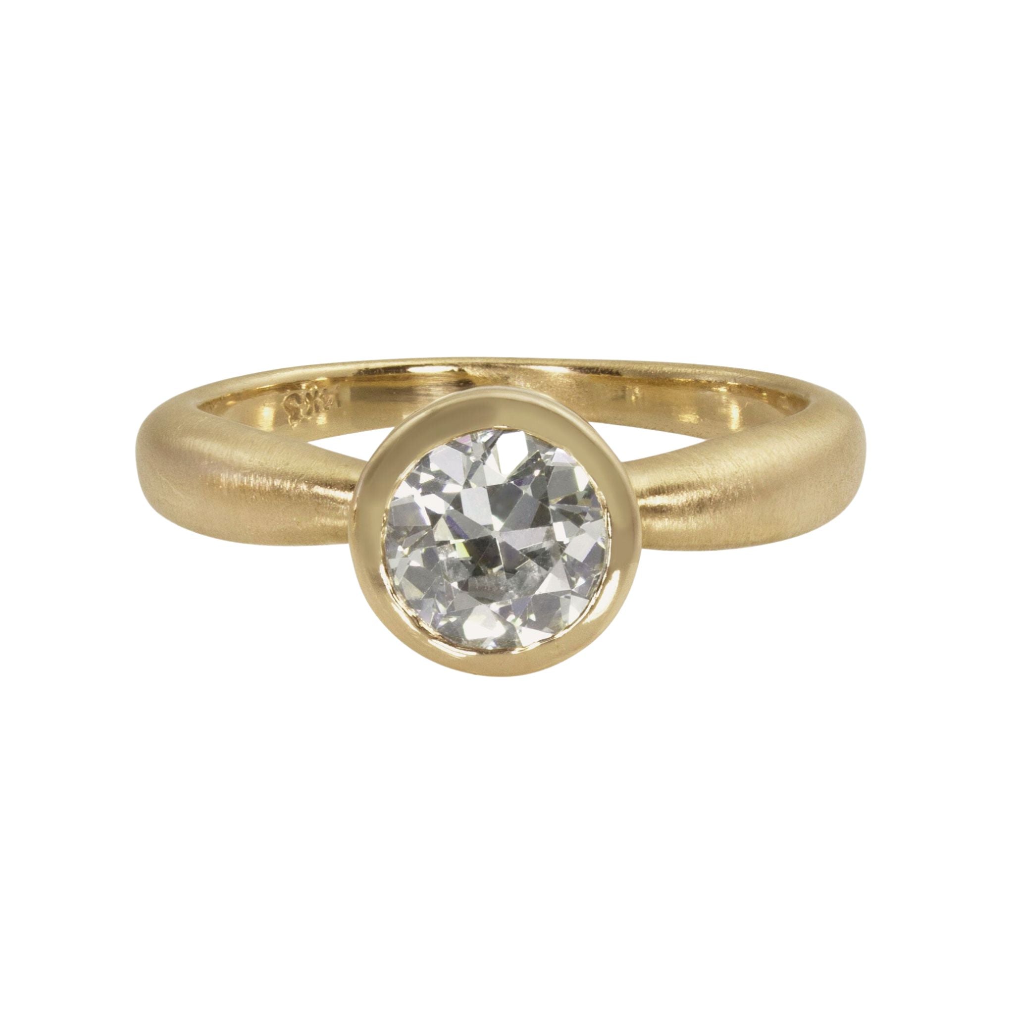 Single stone solitaire round white diamond engagement ring with bezel setting satin finished puffed band on white background