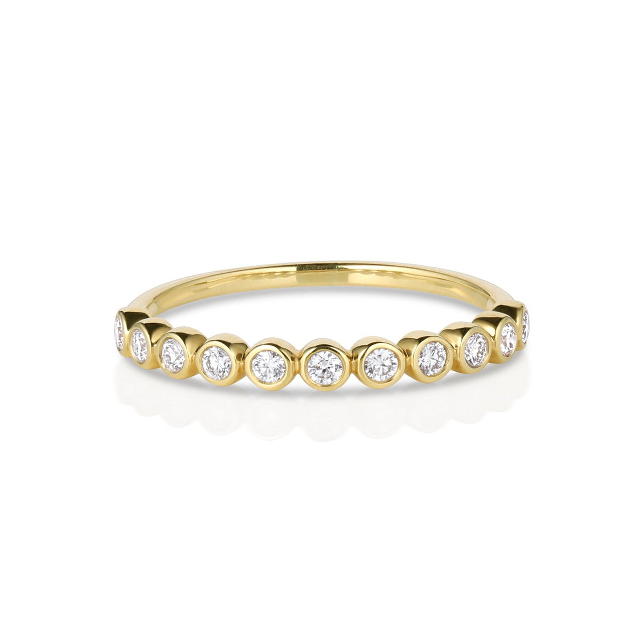 14k gold round bezel set white diamond half eternity wedding band with round bezel set diamonds on white background