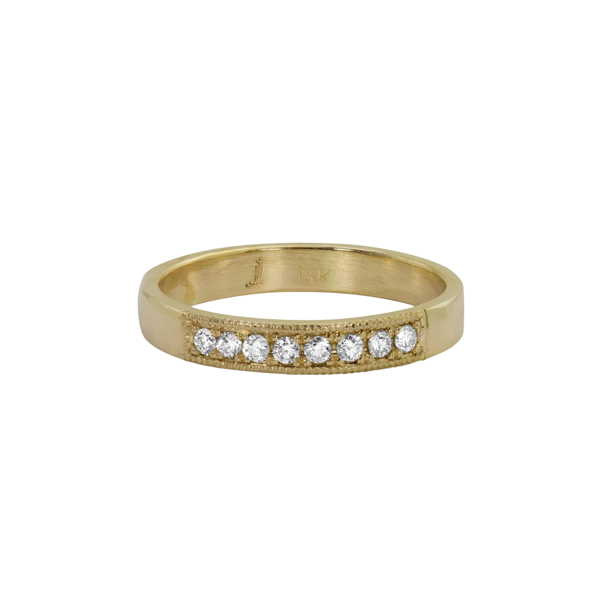 14k yellow gold milgrain white diamond wedding band on white background