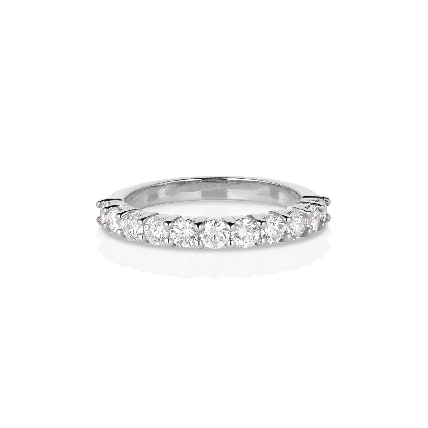 14k white gold prong set small round white diamond half eternity wedding band on white background