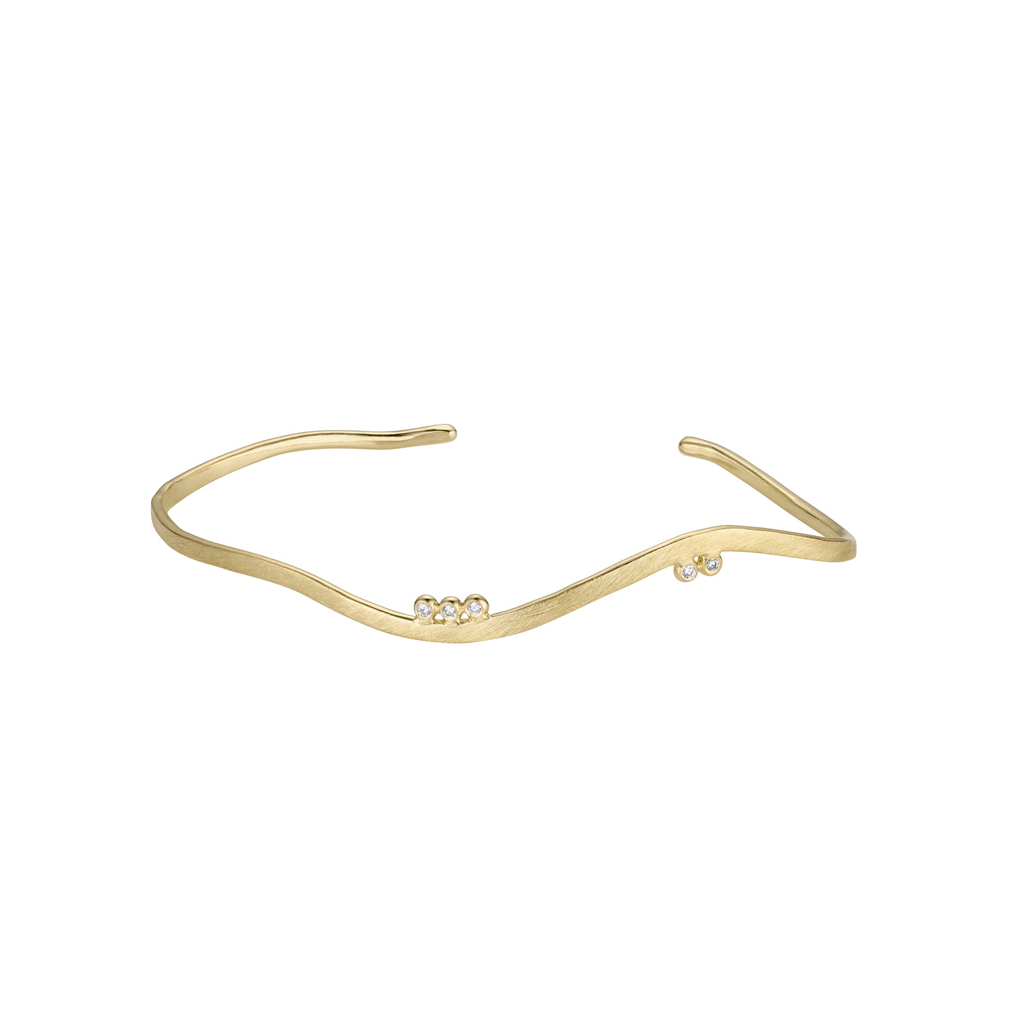 14k yellow gold sculptural cuff bracelet with asymmetrical diamond accents on white background