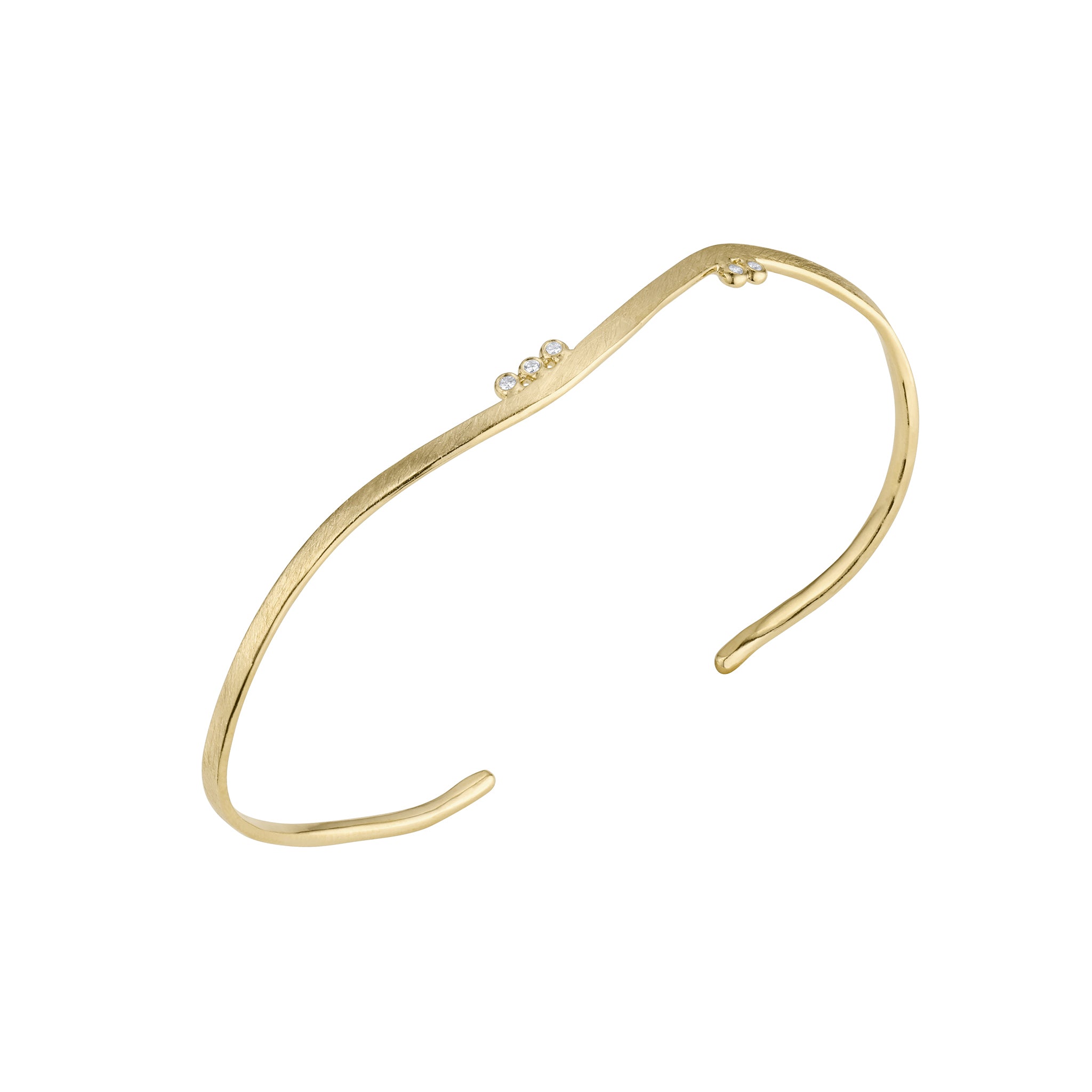 Side view of 14k gold wavy cuff bracelet with cascading bezel set diamonds