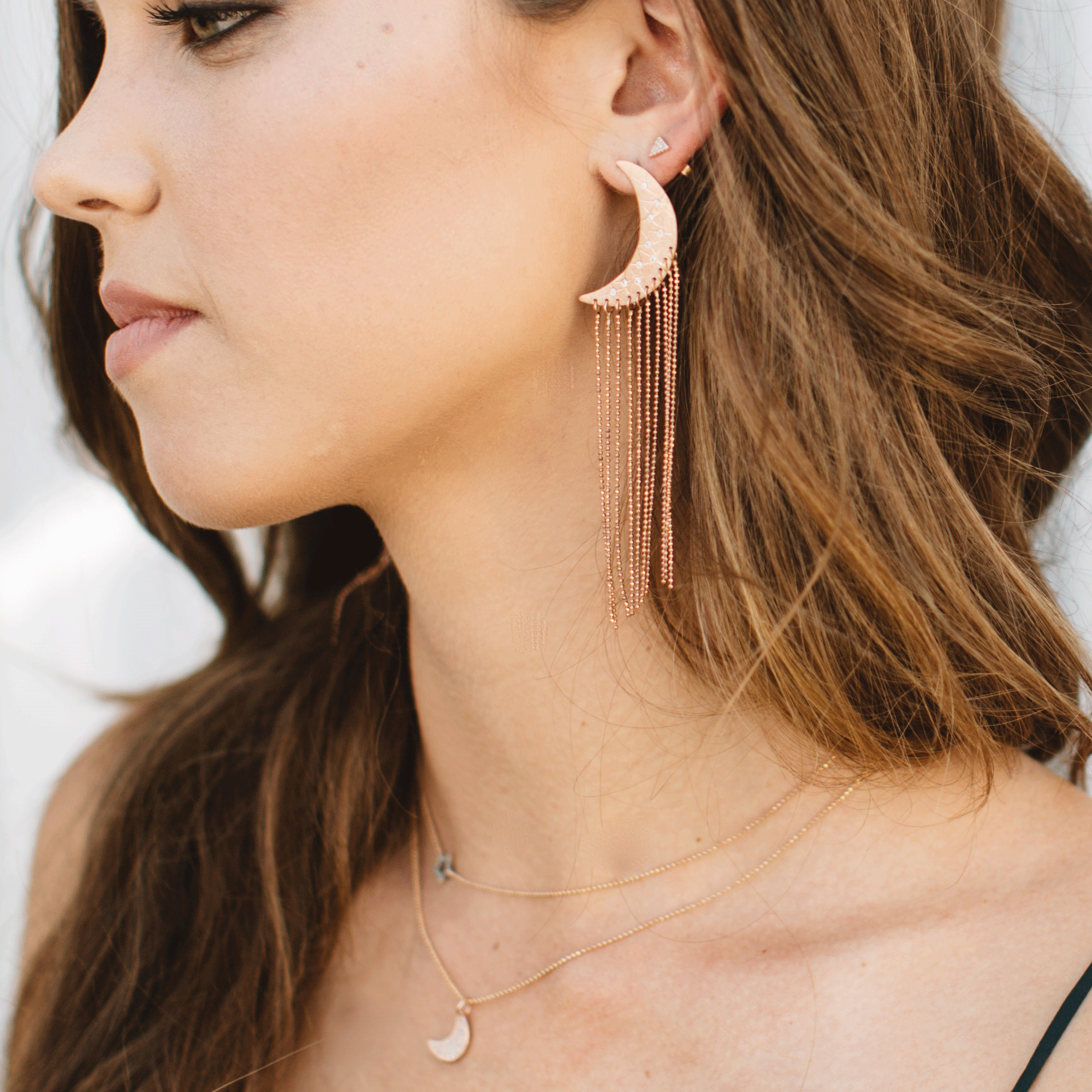 14k rose gold medium ALDA moon post earrings with chain fringe on model
