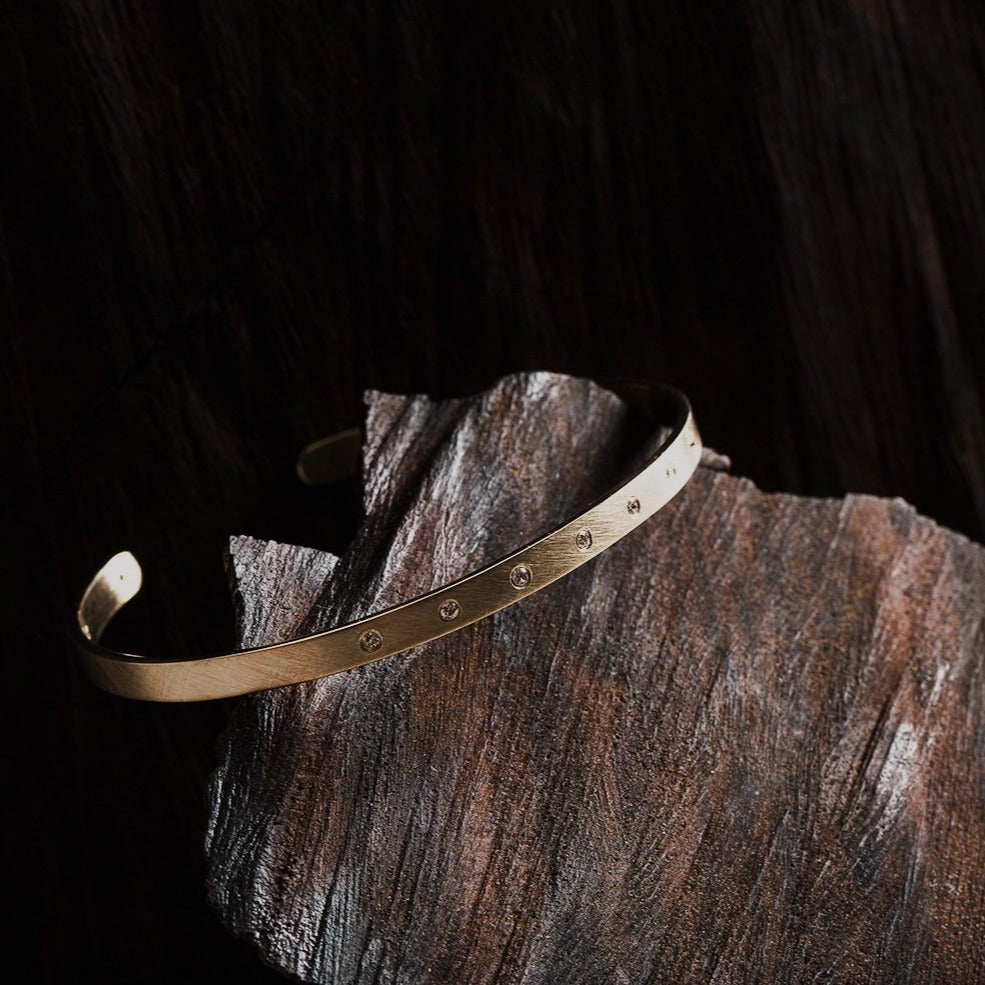 14k gold BOLA cuff bracelet with 7 diamonds in lookbook image