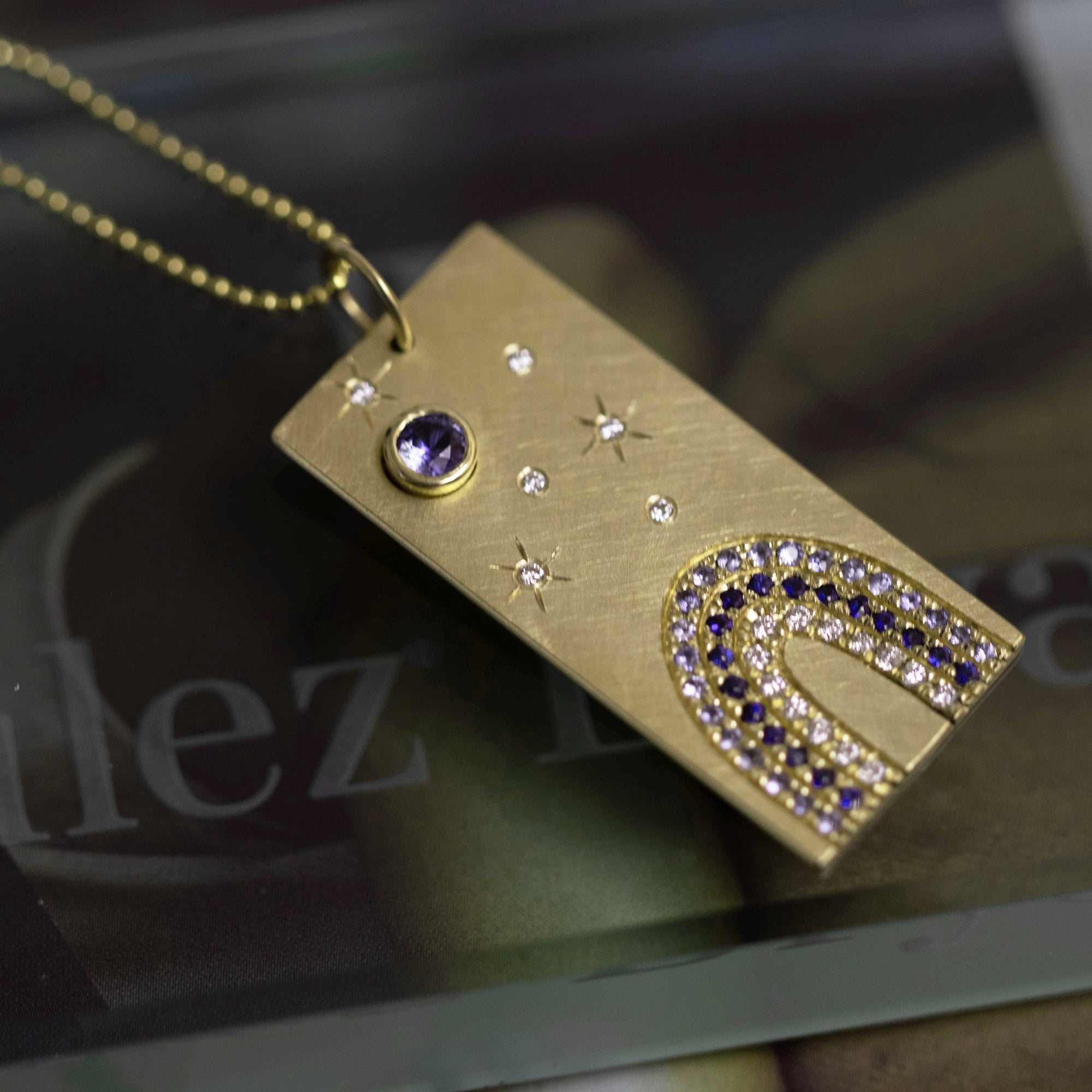 14k yellow gold HOYA vertical bar pendant with white diamonds and blue sapphires