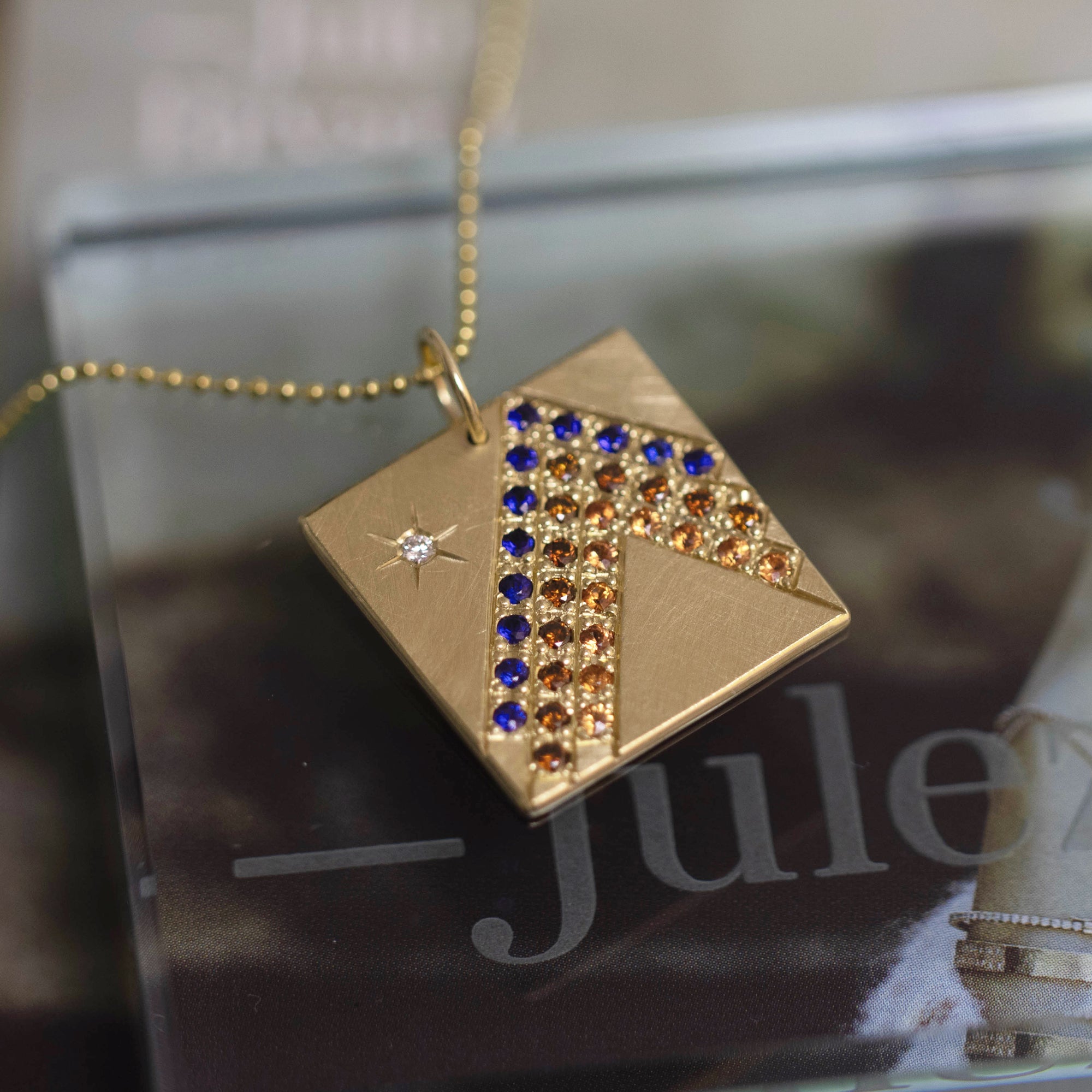 14k yellow gold HOLI square pendant with mixed sapphires