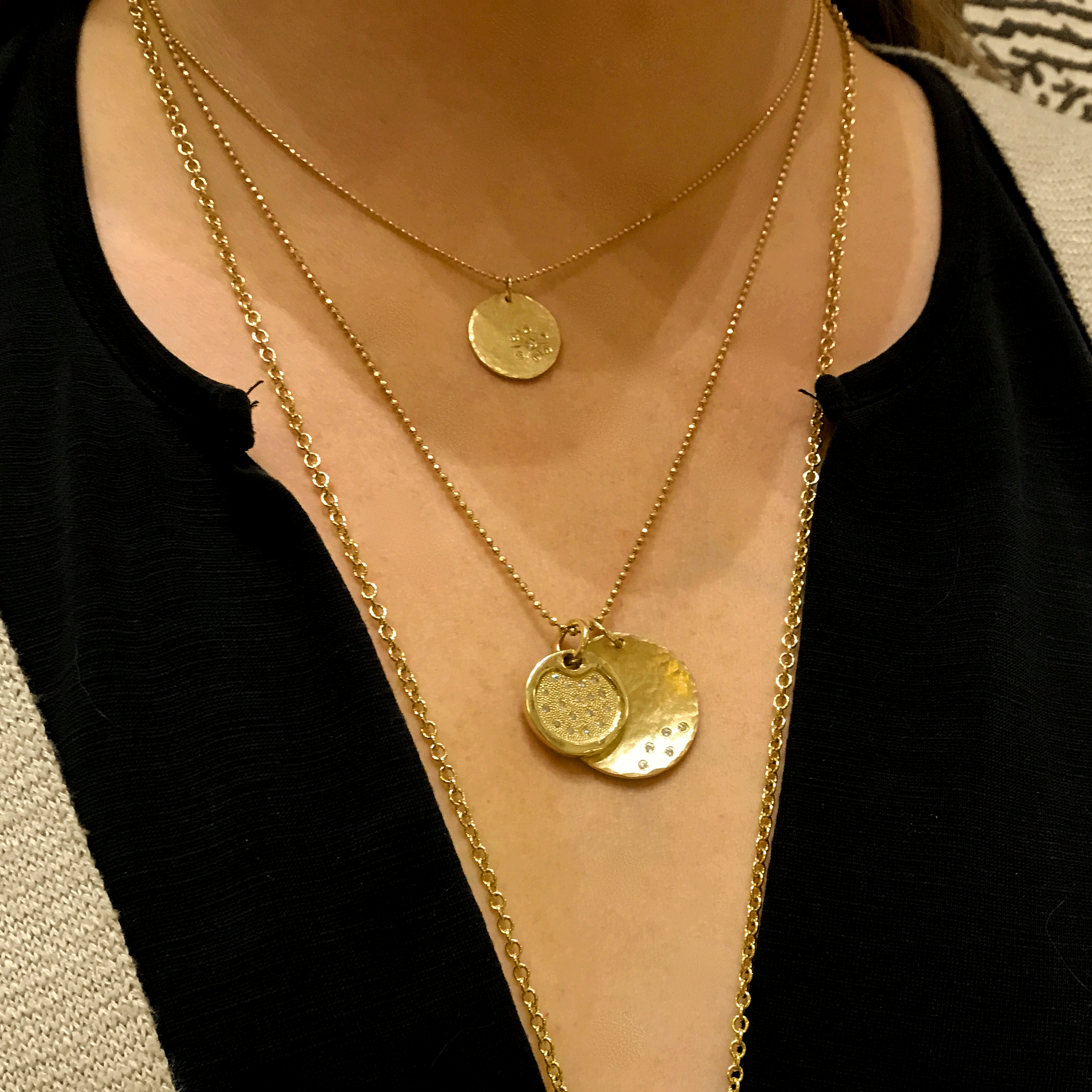 14k yellow gold large DENA pendant with scattered diamonds layered with large MEGG medallion