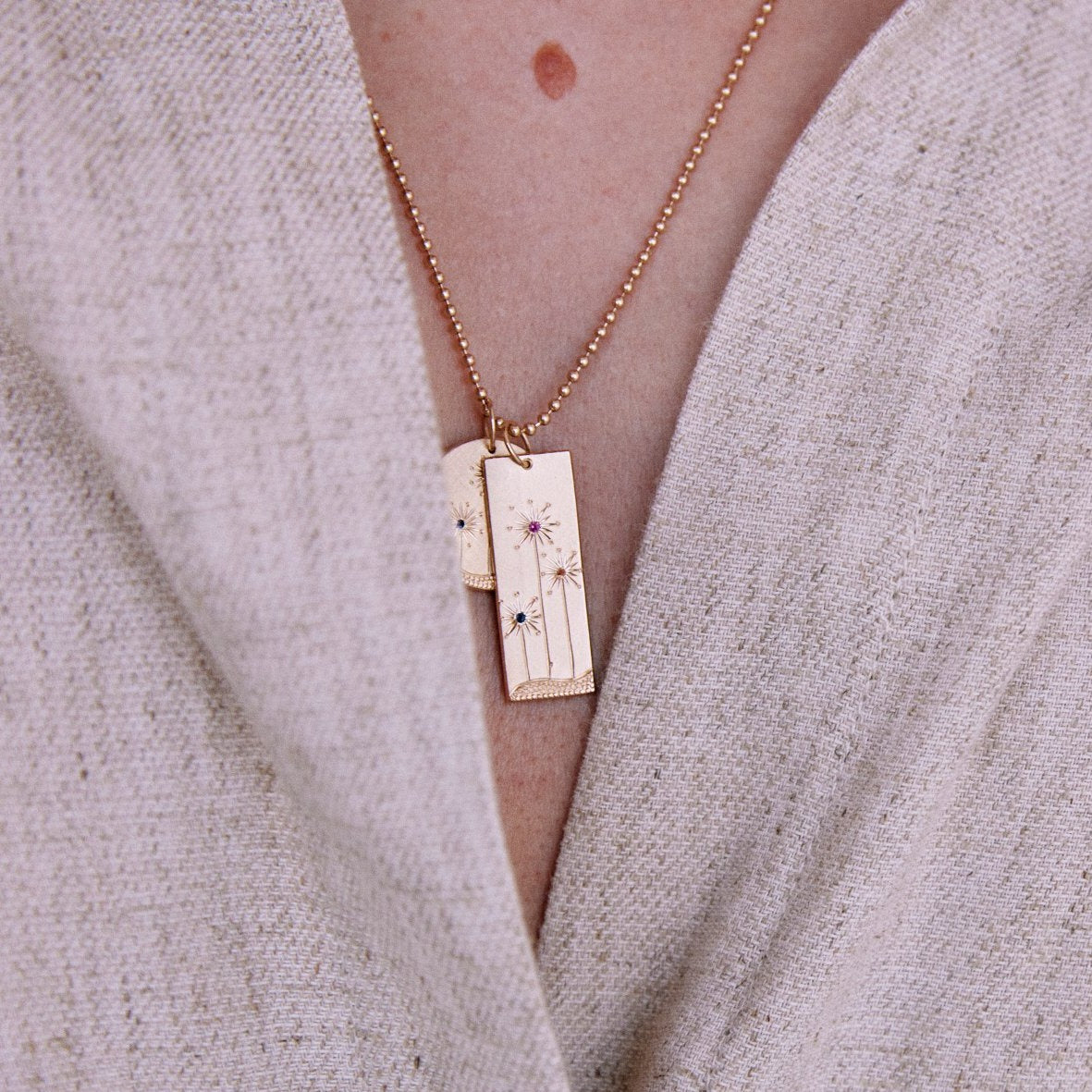 14k gold GIKA and GIKI pendant on model