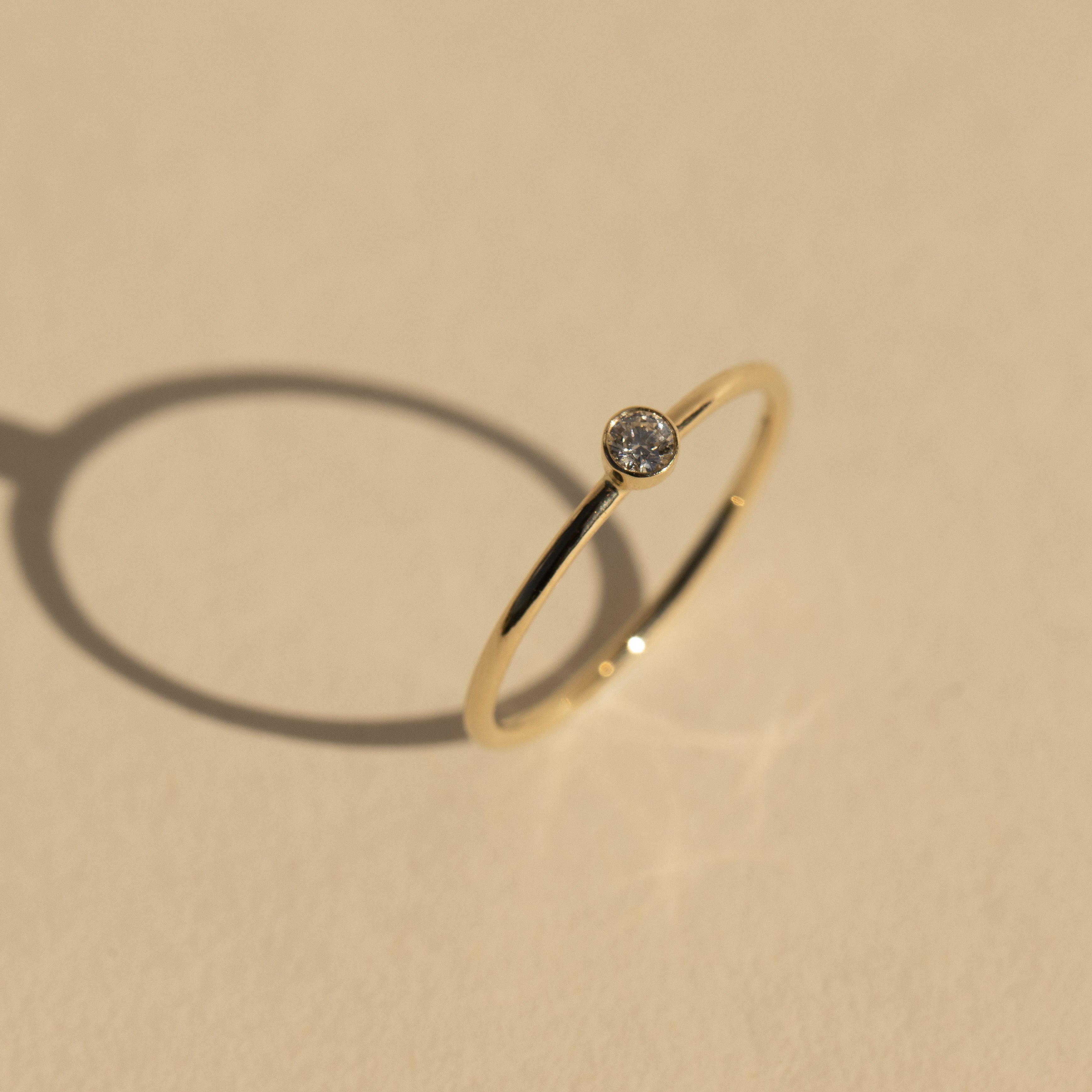 14k gold GELE diamond stacker ring in studio