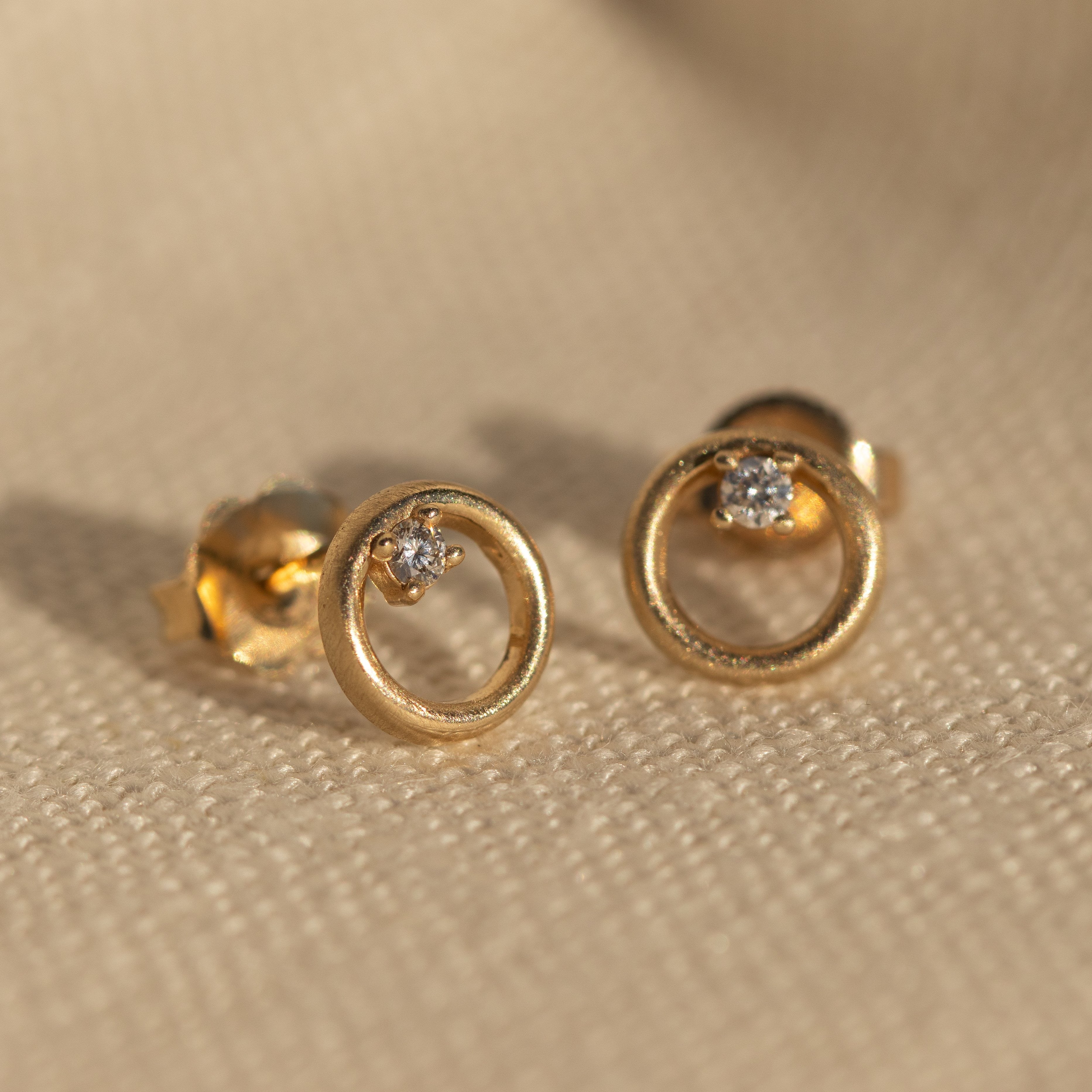 14k gold OKAY circle post earrings in studio