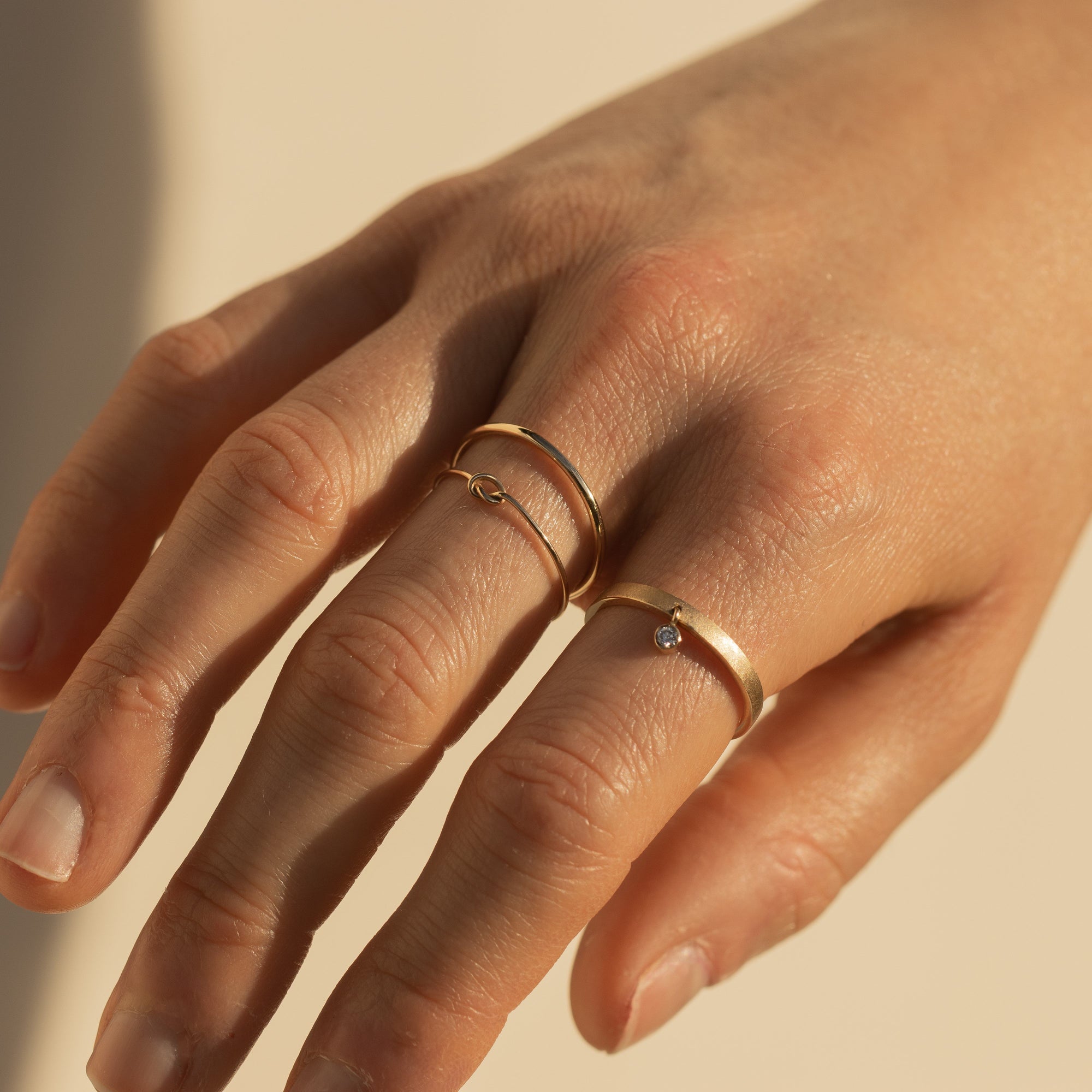 14k gold GELY stacker ring on model with GNOT