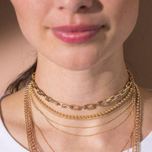 14k yellow gold 3.0mm ball chain choker on model with MICA  link and CHAI necklace.
